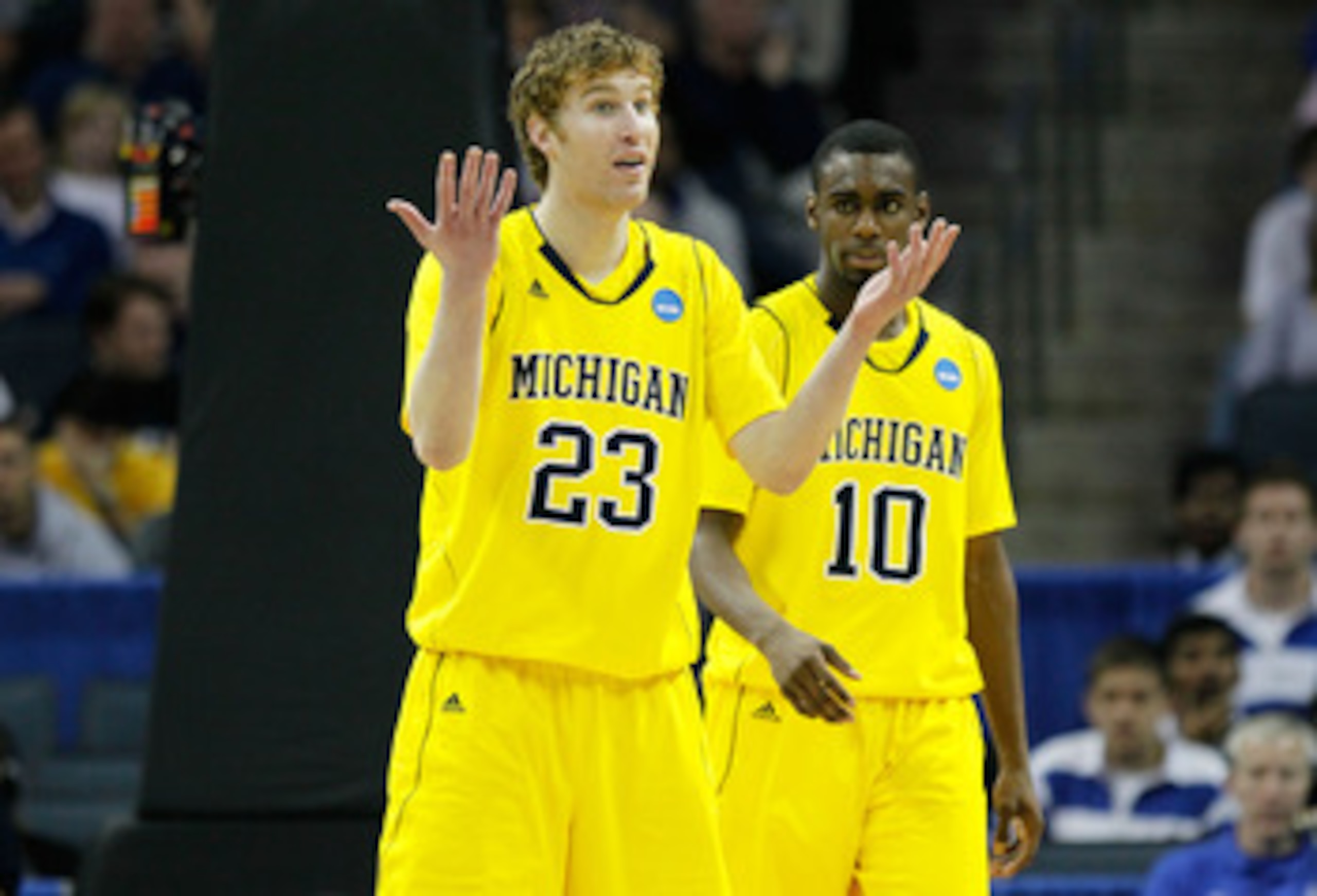 CHARLOTTE, NC - MARCH 20:  Evan Smotrycz #23 and Tim Hardaway Jr. #10 of the Michigan Wolverines react while taking on the Duke Blue Devils during the third round of the 2011 NCAA men's basketball tournament at Time Warner Cable Arena on March 20, 2011 in