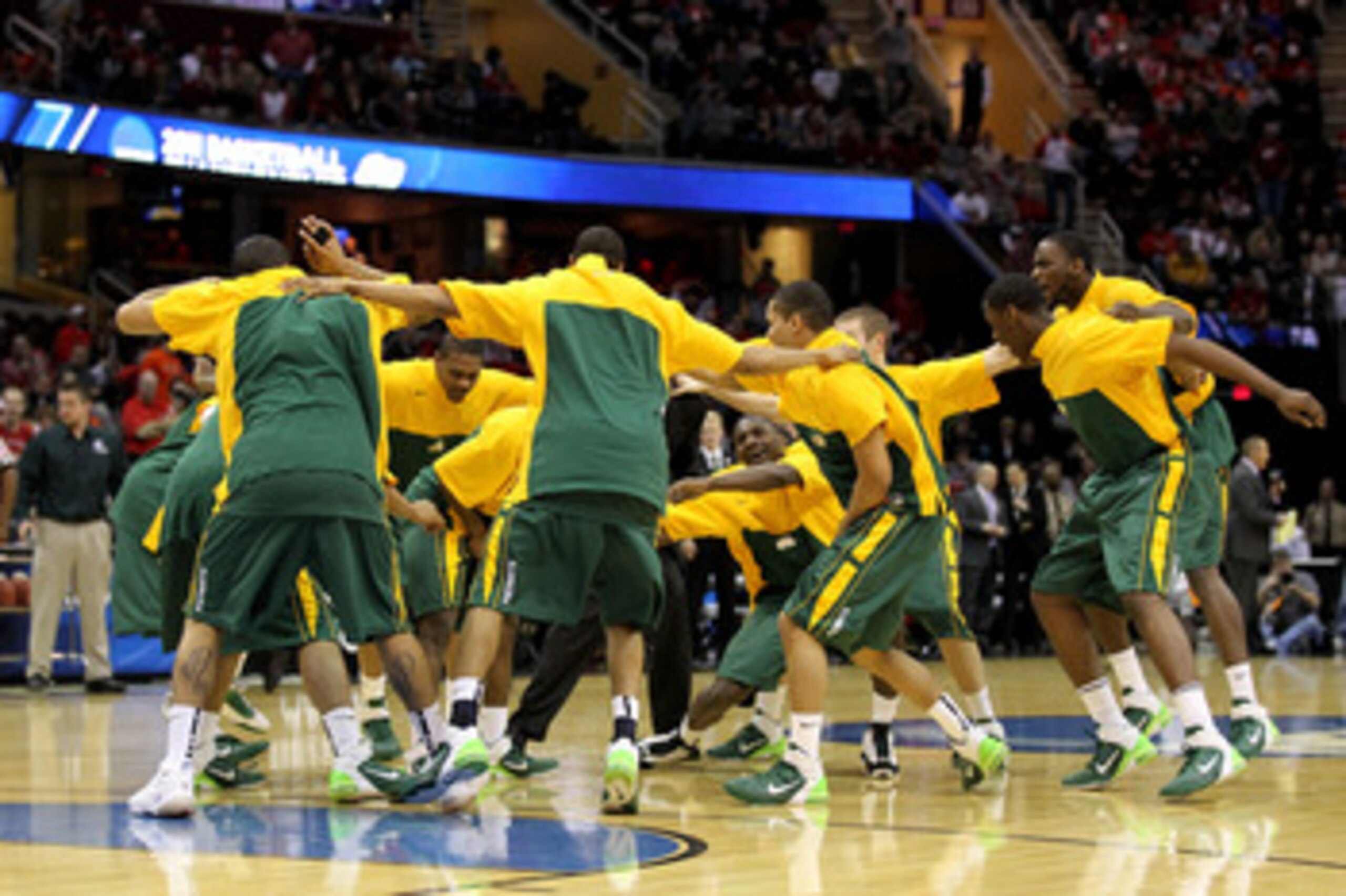 CLEVELAND, OH - MARCH 20: The George Mason Patriots huddle before their game against the Ohio State Buckeyes during the third of the 2011 NCAA men's basketball tournament at Quicken Loans Arena on March 20, 2011 in Cleveland, Ohio.  (Photo by Andy Lyons/G