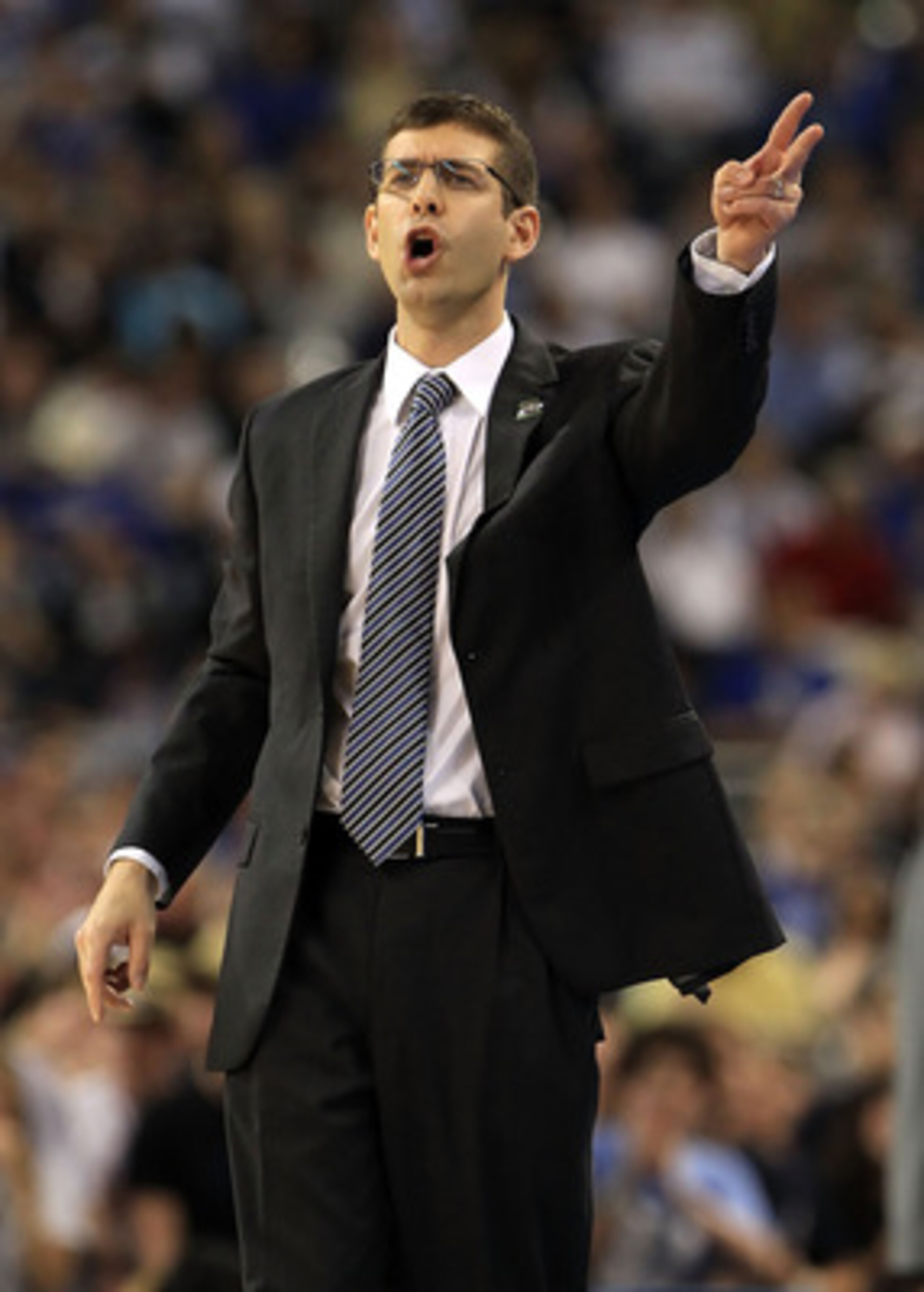 HOUSTON, TX - APRIL 04:  Head coach Brad Stevens of the Butler Bulldogs shouts from the sidelines against the Connecticut Huskies during the National Championship Game of the 2011 NCAA Division I Men's Basketball Tournament at Reliant Stadium on April 4,