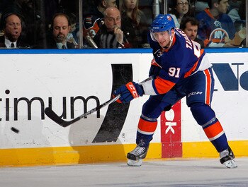 UNIONDALE, NY - MARCH 24:  John Tavares #91 of the New York Islanders skates during an NHL hockey game against the Atlanta Thrashers at the Nassau Coliseum on March 24, 2011 in Uniondale, New York.  (Photo by Paul Bereswill/Getty Images)