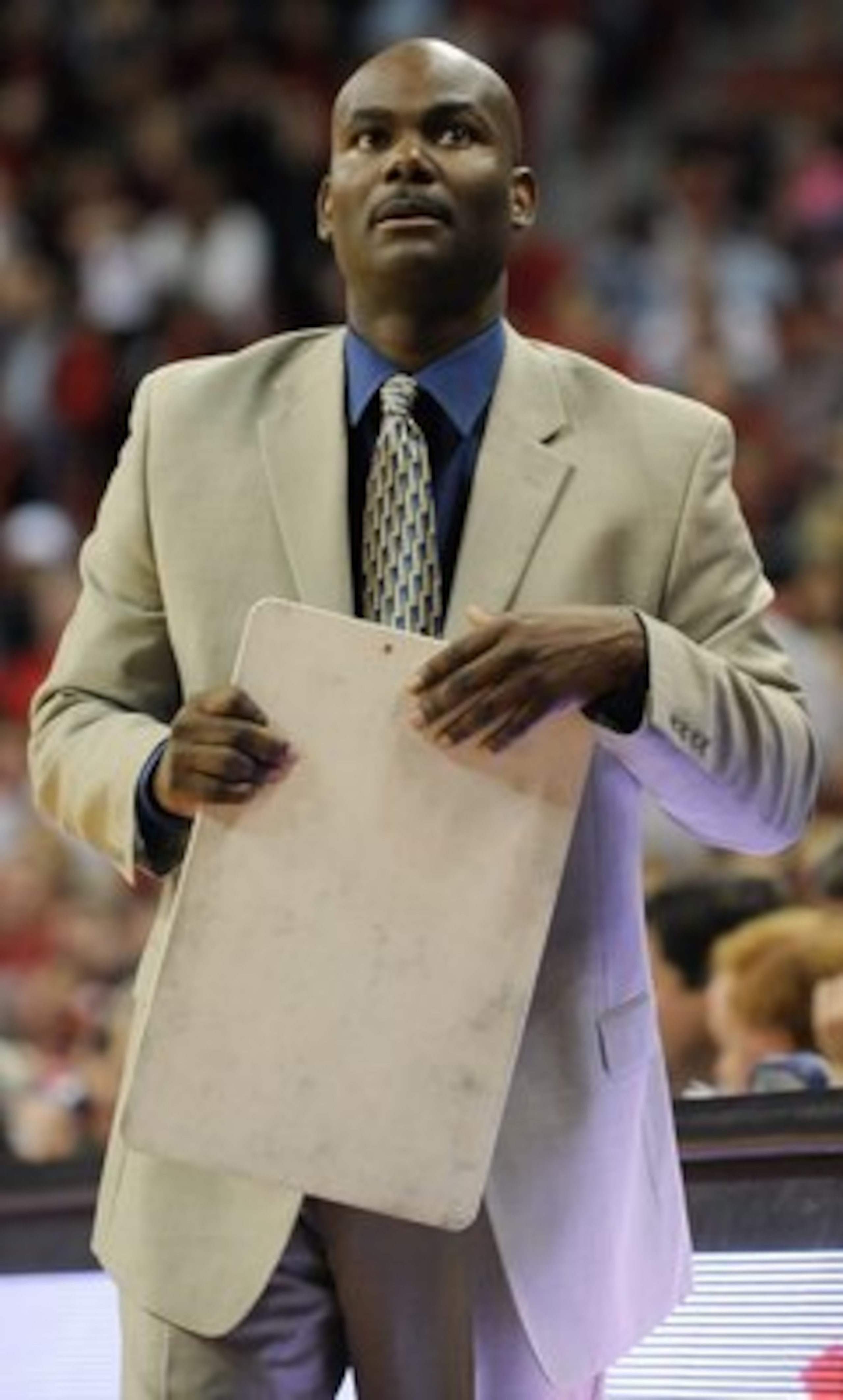 LAS VEGAS - NOVEMBER 18:  Head coach David Carter of the Nevada Wolf Pack checks the scoreboard during a game against the UNLV Rebels at the Thomas & Mack Center on November 18, 2009 in Las Vegas, Nevada. UNLV won 88-75.  (Photo by Ethan Miller/Getty Imag