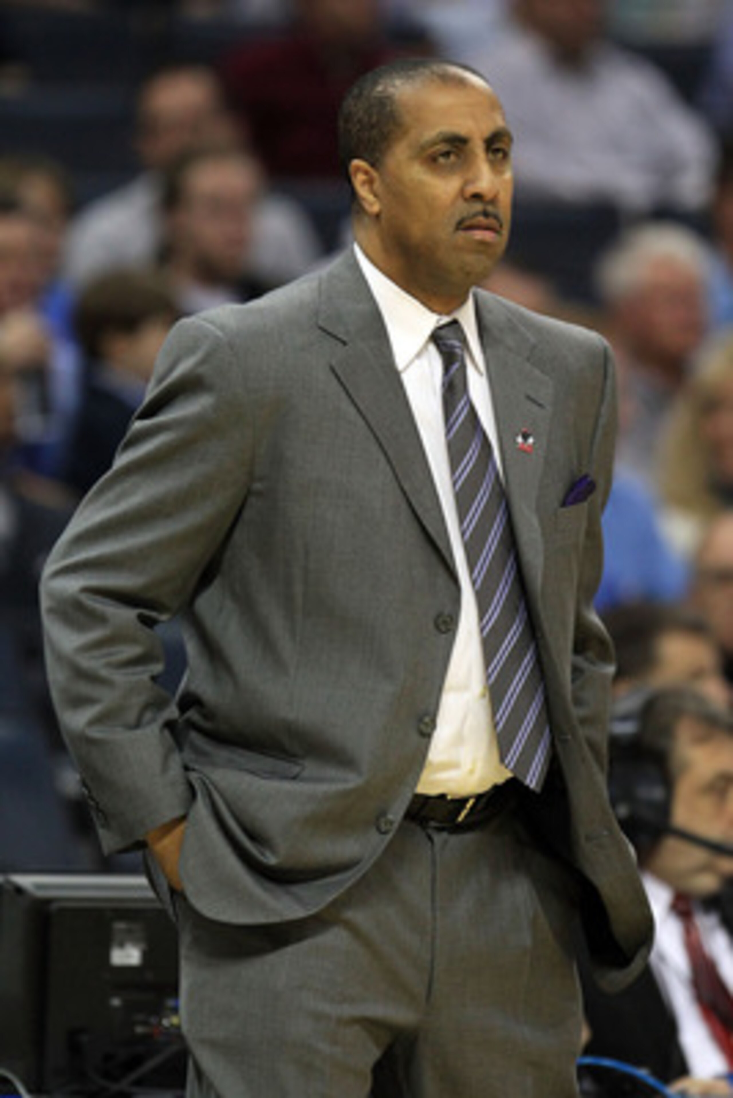 CHARLOTTE, NC - MARCH 20:  Head coach Lorenzo Romar of the Washington Huskies looks on from the sideline in the first half while taking on the North Carolina Tar Heels during the third round of the 2011 NCAA men's basketball tournament at Time Warner Cabl
