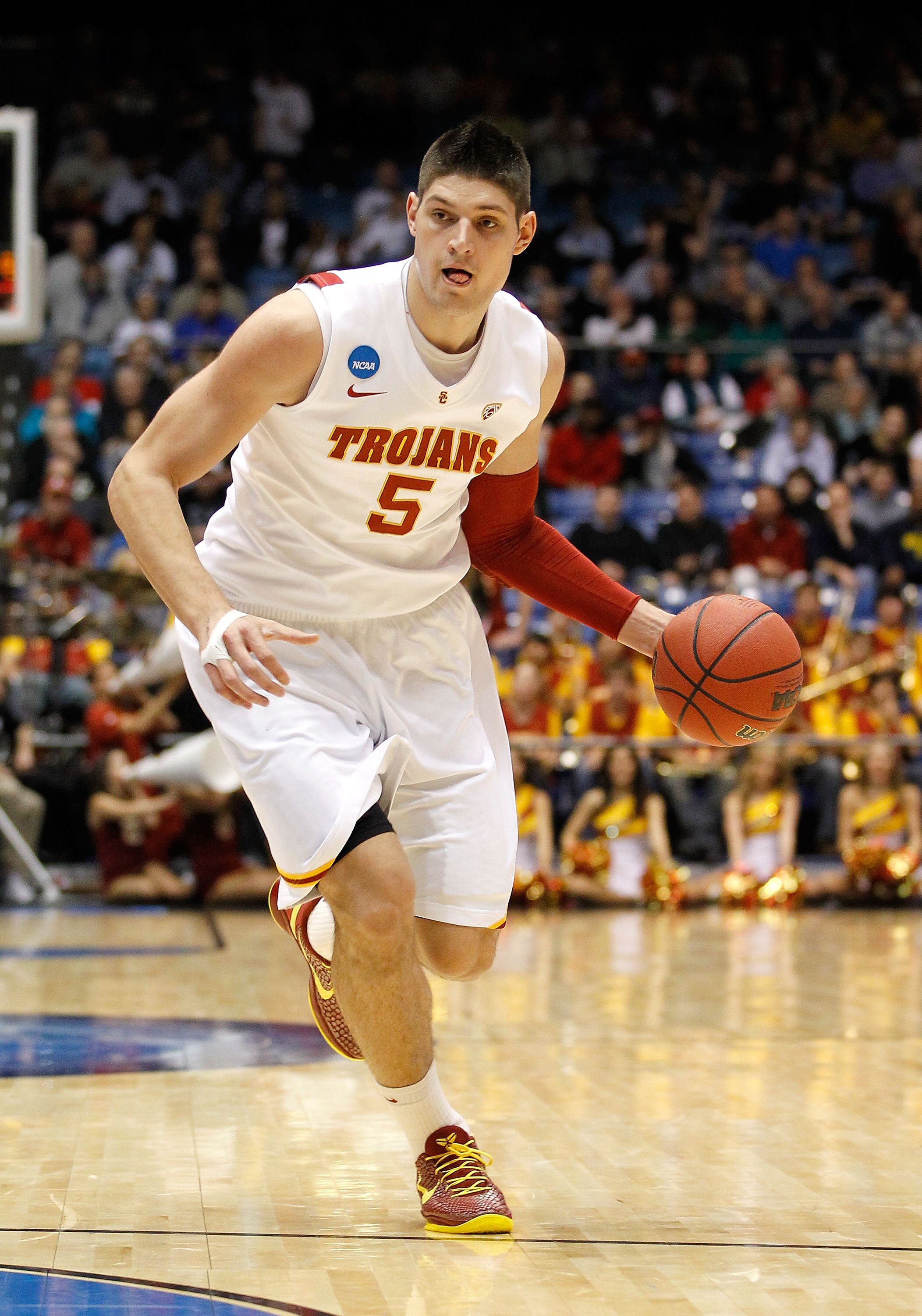 DAYTON, OH - MARCH 16: Nikola Vucevic #5 of the USC Trojans handles the ball against the Virginia Commonwealth Rams during the first round of the 2011 NCAA men's basketball tournament at UD Arena on March 16, 2011 in Dayton, Ohio.  (Photo by Gregory Shamu