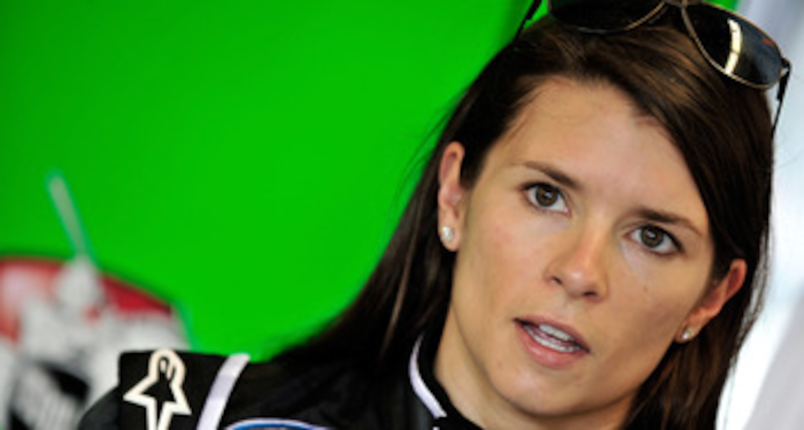 JOLIET, IL - JUNE 04: Danica Patrick, driver of the #7 Tissot/GoDaddy.com, stands in the garage area after qualifying was cancelled due to rain, for the NASCAR Nationwide Series STP 300 at Chicagoland Speedway on June 4, 2011 in Joliet, Illinois. (Photo JOLIET, IL - JUNE 04: Danica Patrick, driver of the #7 Tissot/GoDaddy.com, stands in the garage area after qualifying was cancelled due to rain, for the NASCAR Nationwide Series STP 300 at Chicagoland Speedway on June 4, 2011 in Joliet, Illinois. (Photo
