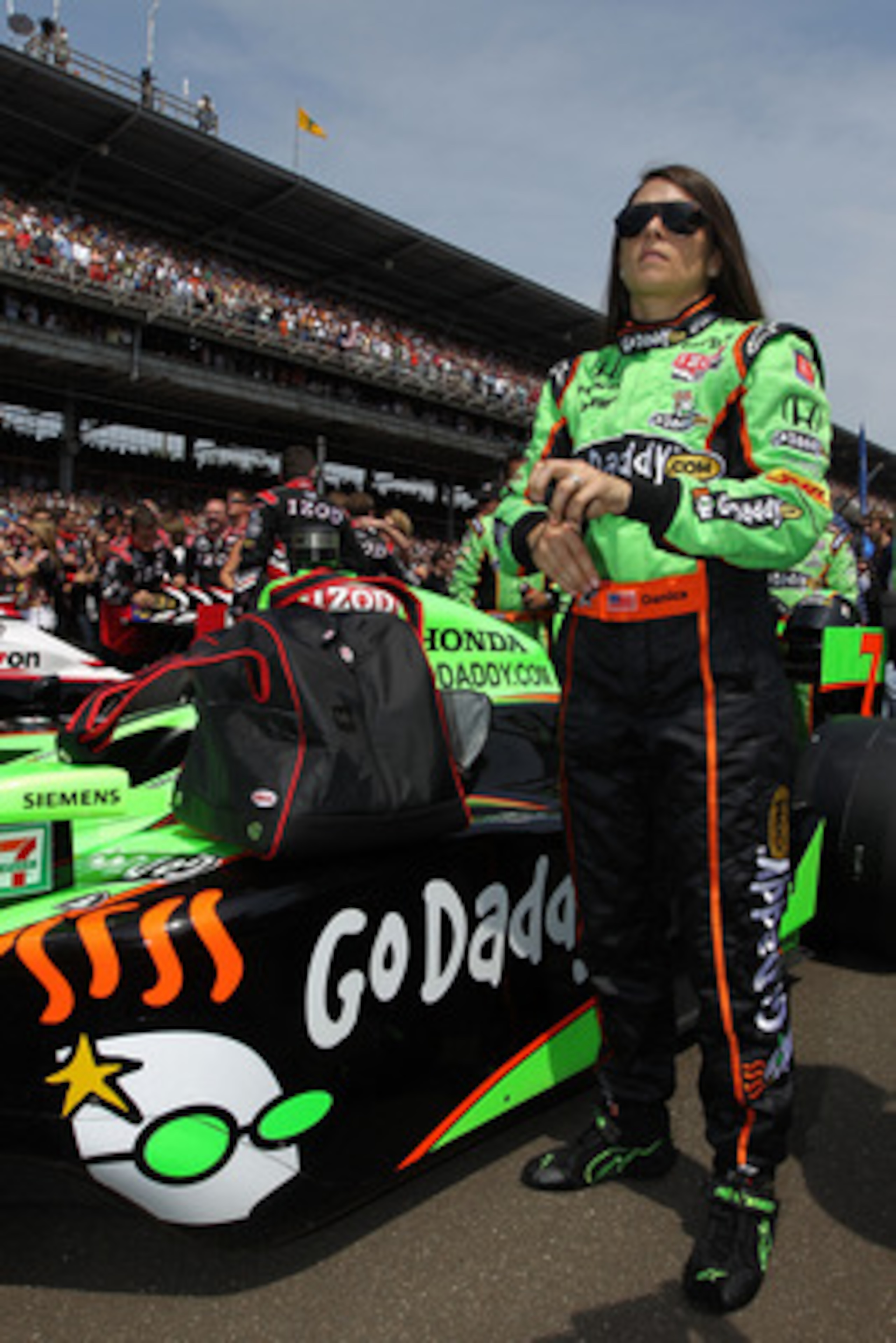 INDIANAPOLIS, IN - MAY 29: Danica Patrick, driver of the #7 Team GoDaddy Dallara Honda, stands next to her car prior to the IZOD IndyCar Series Indianapolis 500 Mile Race at Indianapolis Motor Speedway on May 29, 2011 in Indianapolis, Indiana. (Photo by INDIANAPOLIS, IN - MAY 29: Danica Patrick, driver of the #7 Team GoDaddy Dallara Honda, stands next to her car prior to the IZOD IndyCar Series Indianapolis 500 Mile Race at Indianapolis Motor Speedway on May 29, 2011 in Indianapolis, Indiana. (Photo by