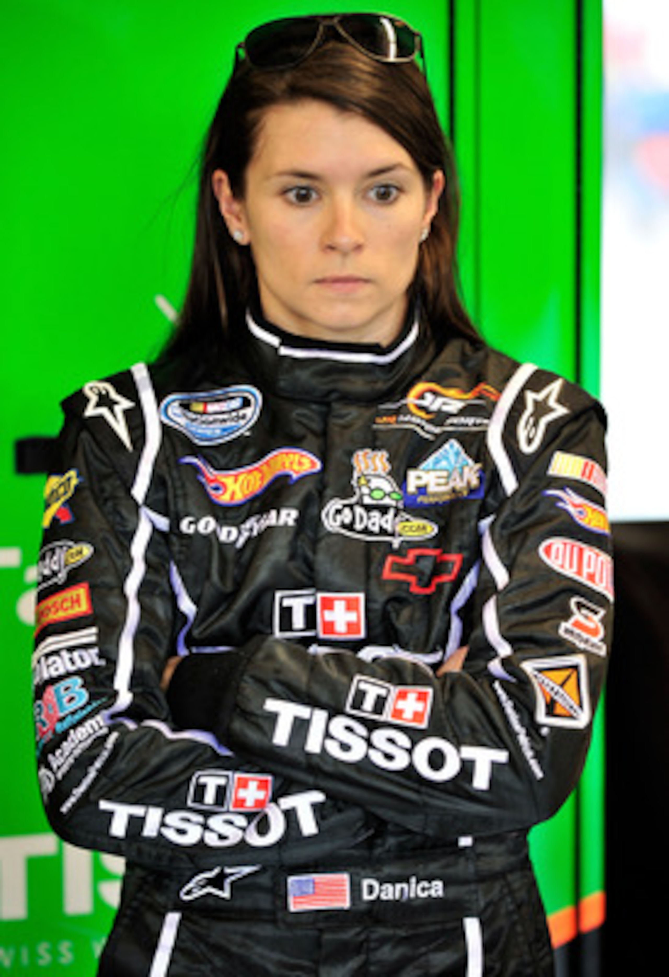 JOLIET, IL - JUNE 04: Danica Patrick, driver of the #7 Tissot/GoDaddy.com, stands in the garage area after qualifying was cancelled due to rain, for the NASCAR Nationwide Series STP 300 at Chicagoland Speedway on June 4, 2011 in Joliet, Illinois. (Photo JOLIET, IL - JUNE 04: Danica Patrick, driver of the #7 Tissot/GoDaddy.com, stands in the garage area after qualifying was cancelled due to rain, for the NASCAR Nationwide Series STP 300 at Chicagoland Speedway on June 4, 2011 in Joliet, Illinois. (Photo