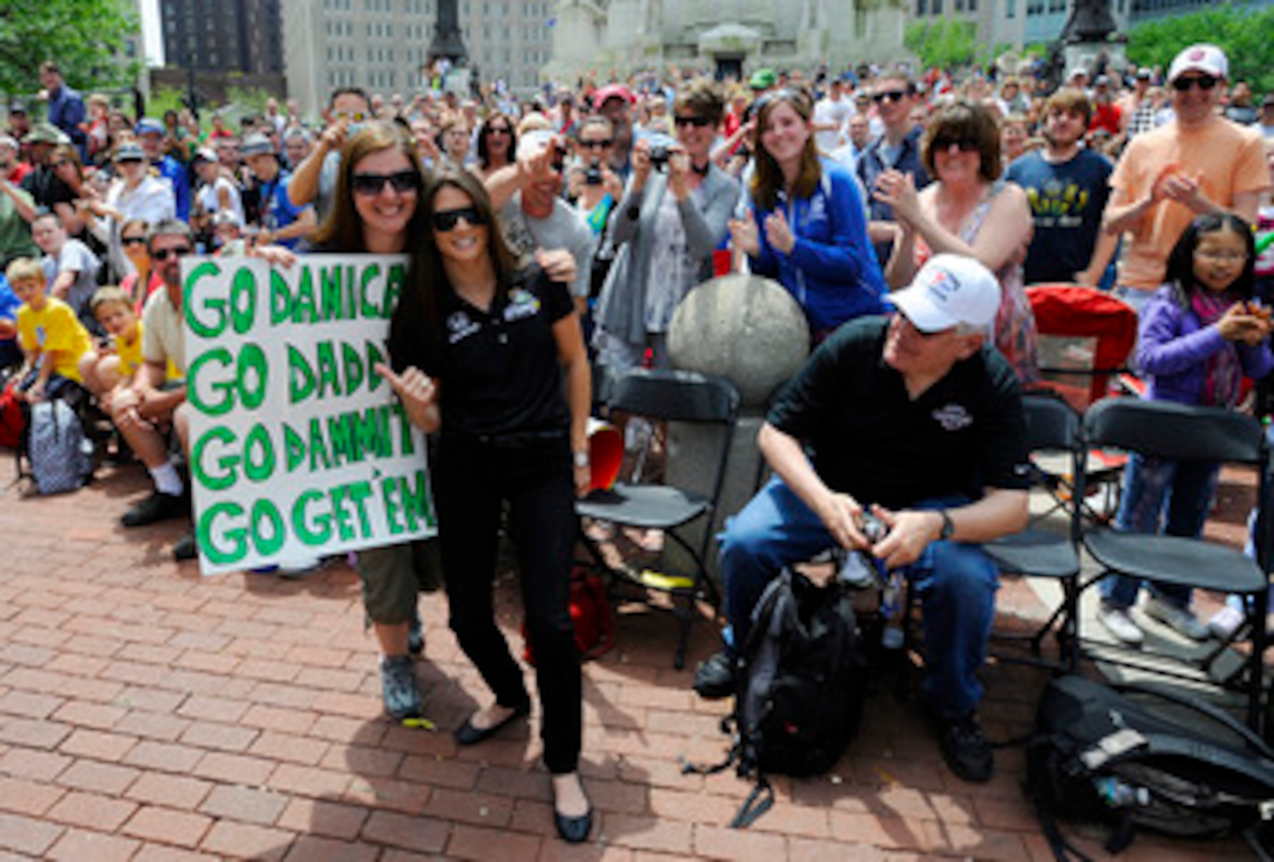 INDIANAPOLIS, IN - MAY 28: Danica Patrick driver of the #7 Andretti Autosport Dallara Honda poses with fans during the parade for the 100th Anniversary of the Indianapolis 500 on May 28, 2011 in the streets of Indianapolis, Indiana. (Photo by Robert Lab INDIANAPOLIS, IN - MAY 28: Danica Patrick driver of the #7 Andretti Autosport Dallara Honda poses with fans during the parade for the 100th Anniversary of the Indianapolis 500 on May 28, 2011 in the streets of Indianapolis, Indiana. (Photo by Robert Lab