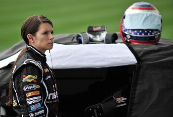 JOLIET, IL - JUNE 04:  Danica Patrick, driver of the #7 Tissot/GoDaddy.com, stands on the grid during qualifying for the NASCAR Nationwide Series STP 300 at Chicagoland Speedway on June 4, 2011 in Joliet, Illinois.  (Photo by Jason Smith/Getty Images for