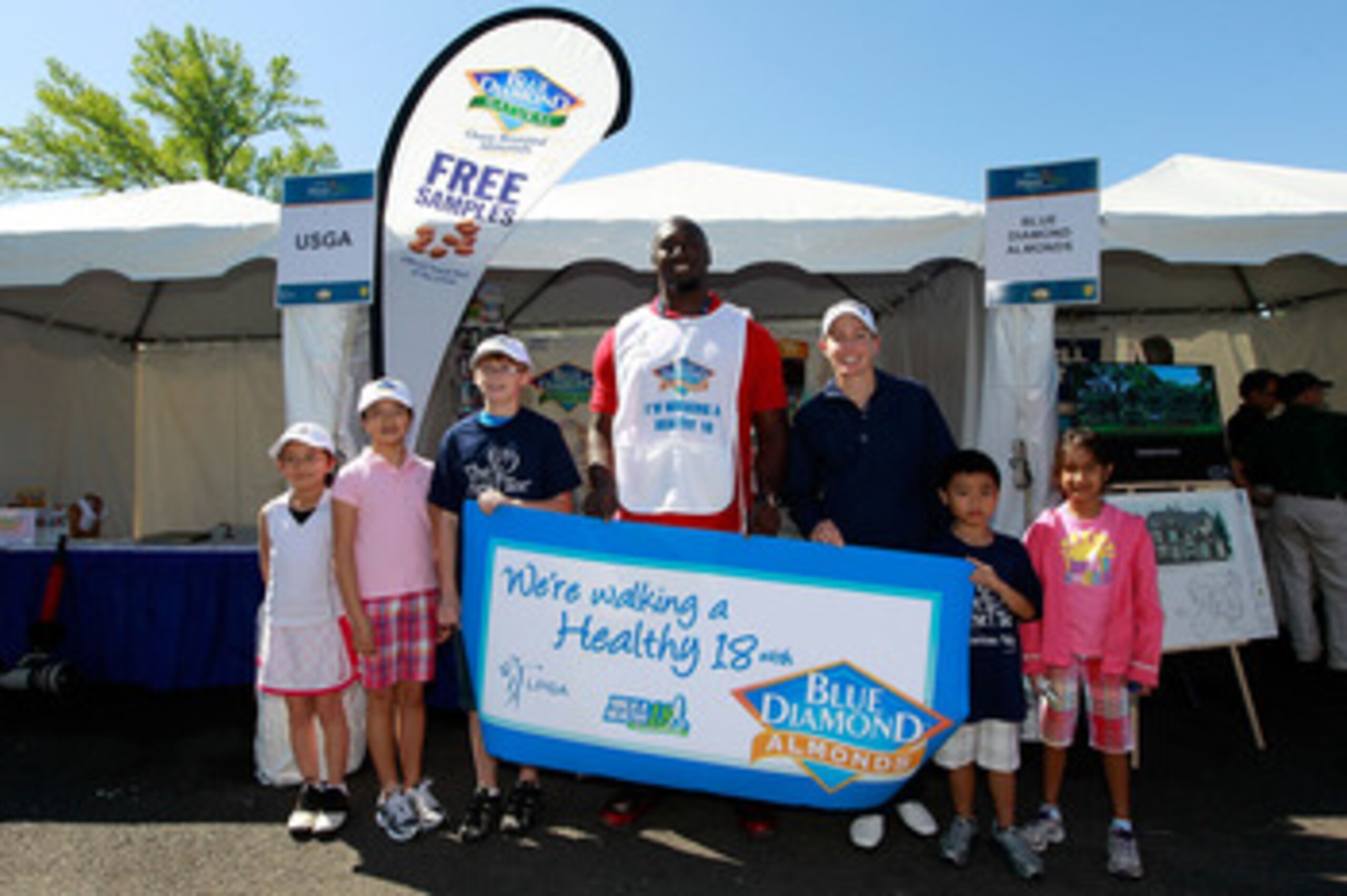 GLADSTONE, NJ - MAY 21: NFL player Muhammad Wilkerson of the New York Jets joins LPGA player Stephanie Louden and local junior golfers to support Blue Diamond Almonds 'Walk A Healthy 18' program at the Sybase Match Play Championship at Hamilton Farm Golf