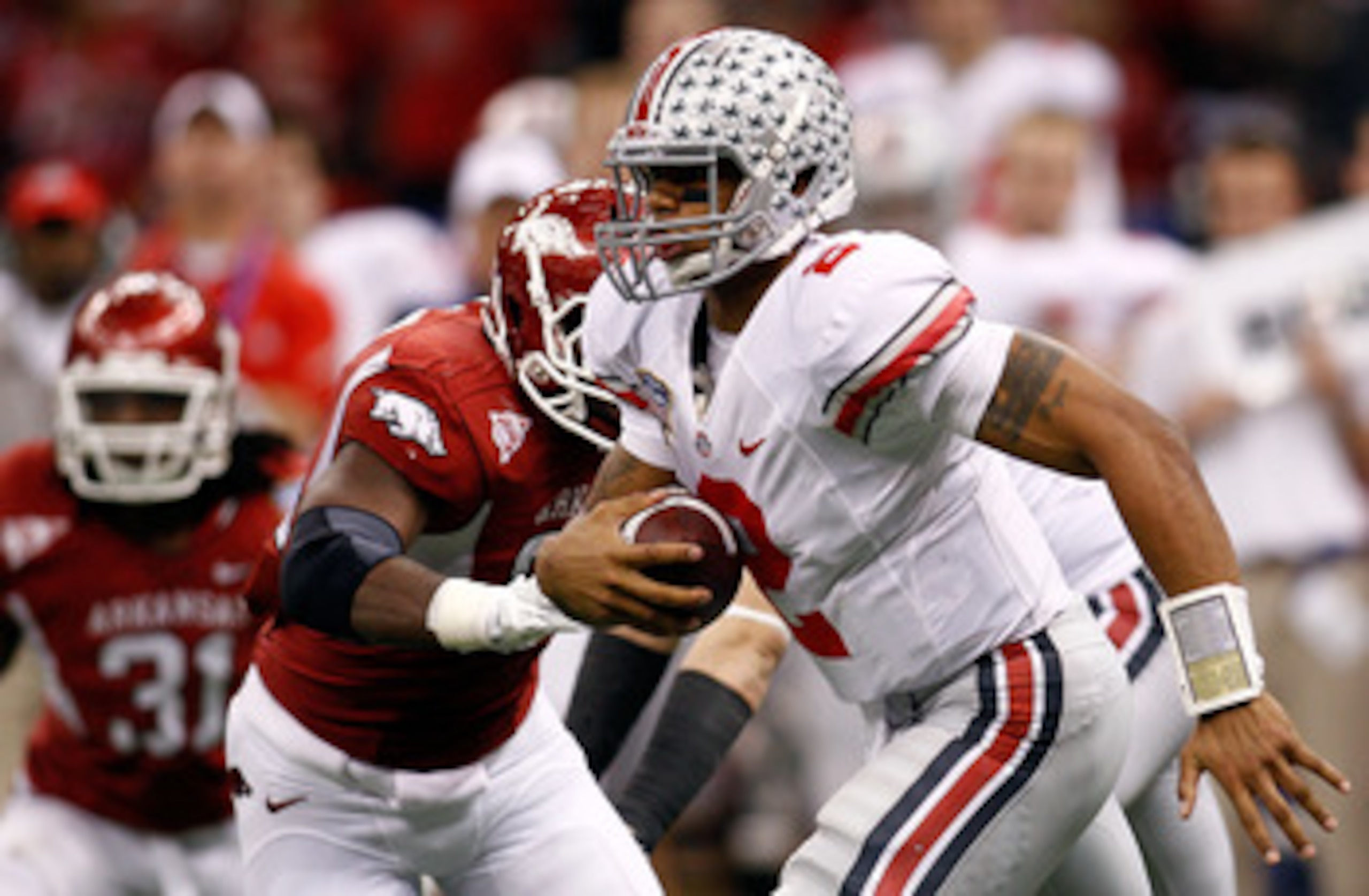 NEW ORLEANS, LA - JANUARY 04:  Quarterback Terrelle Pryor #2 of the Ohio State Buckeyes looks to run against the Arkansas Razorbacks during the Allstate Sugar Bowl at the Louisiana Superdome on January 4, 2011 in New Orleans, Louisiana.  (Photo by Chris G