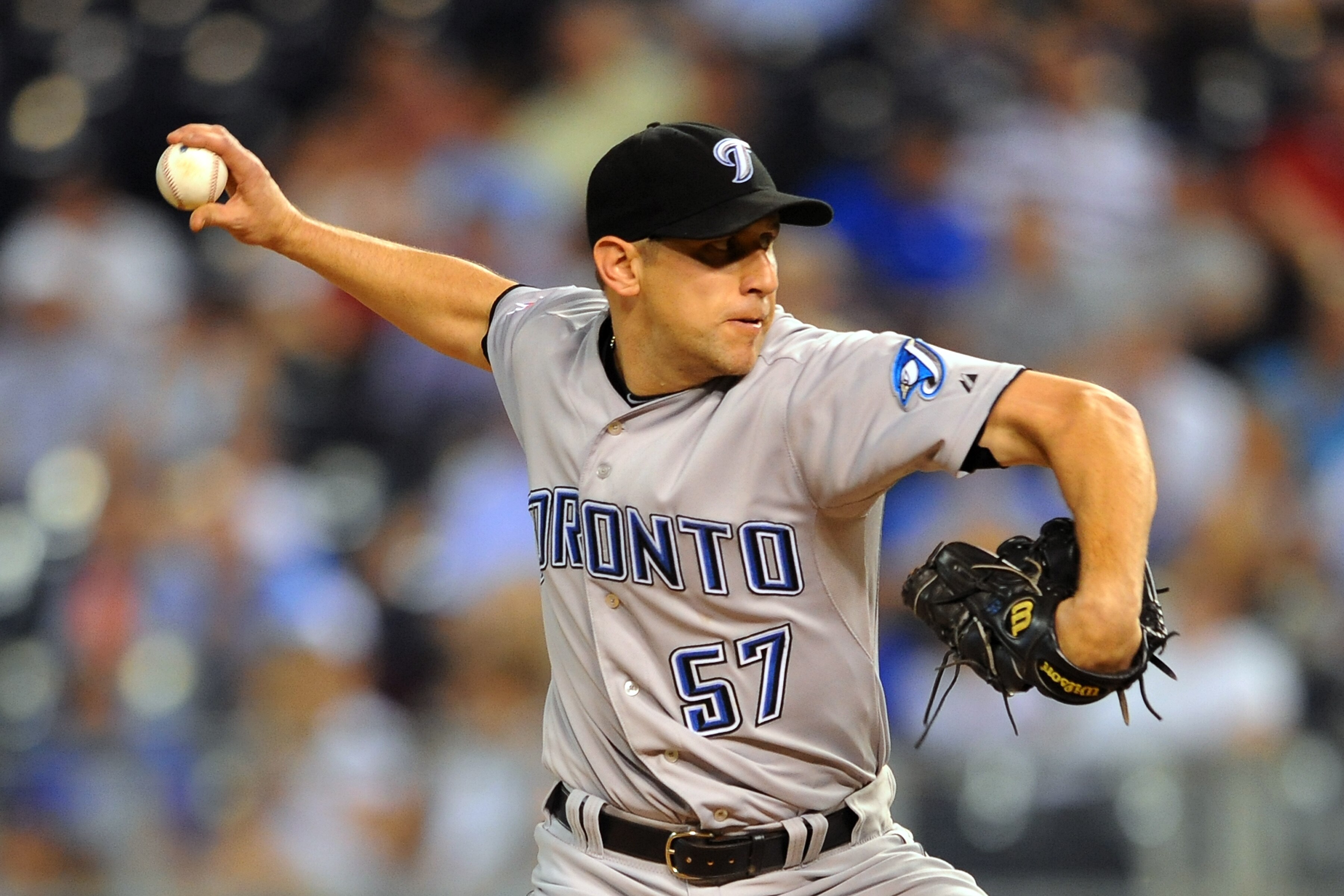 KANSAS CITY, MO - JUNE 6:  Reliever Shawn Camp #57 of the Toronto Blue Jays throws a pitch against the Kansas City Royals at Kauffman Stadium on June 5, 2011 in Kansas City, Missouri. (Photo by G. Newman Lowrance/Getty Images)