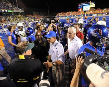 BOISE, ID - SEPTEMBER 3: Head coach Chip Kelly of the Oregon Ducks shakes hands with head coach Chris Petersen of the Boise State Broncos after the Broncos defeated the Ducks 19-8 at Bronco Stadium on September 3, 2009 in Boise, Idaho. (Photo by Steve Dyk