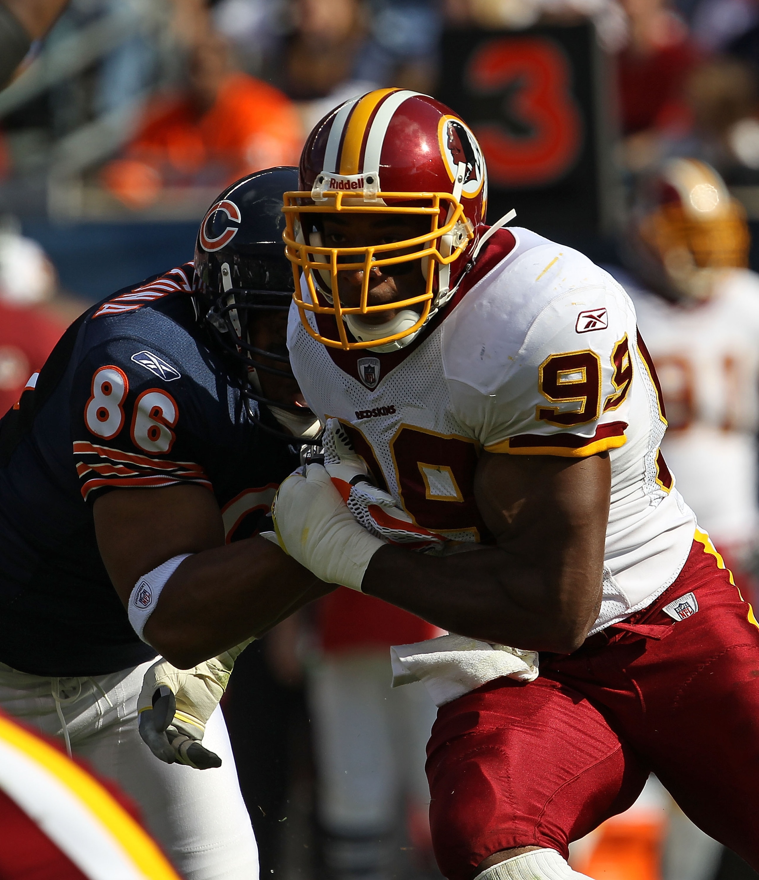 CHICAGO - OCTOBER 24: Andre Carter #99 of the Washington Redskins rushes against Brandon Manumaleuna #86 of the Chicago Bears at Soldier Field on October 24, 2010 in Chicago, Illinois. The Redskins defeated the Bears 17-14. (Photo by Jonathan Daniel/Getty