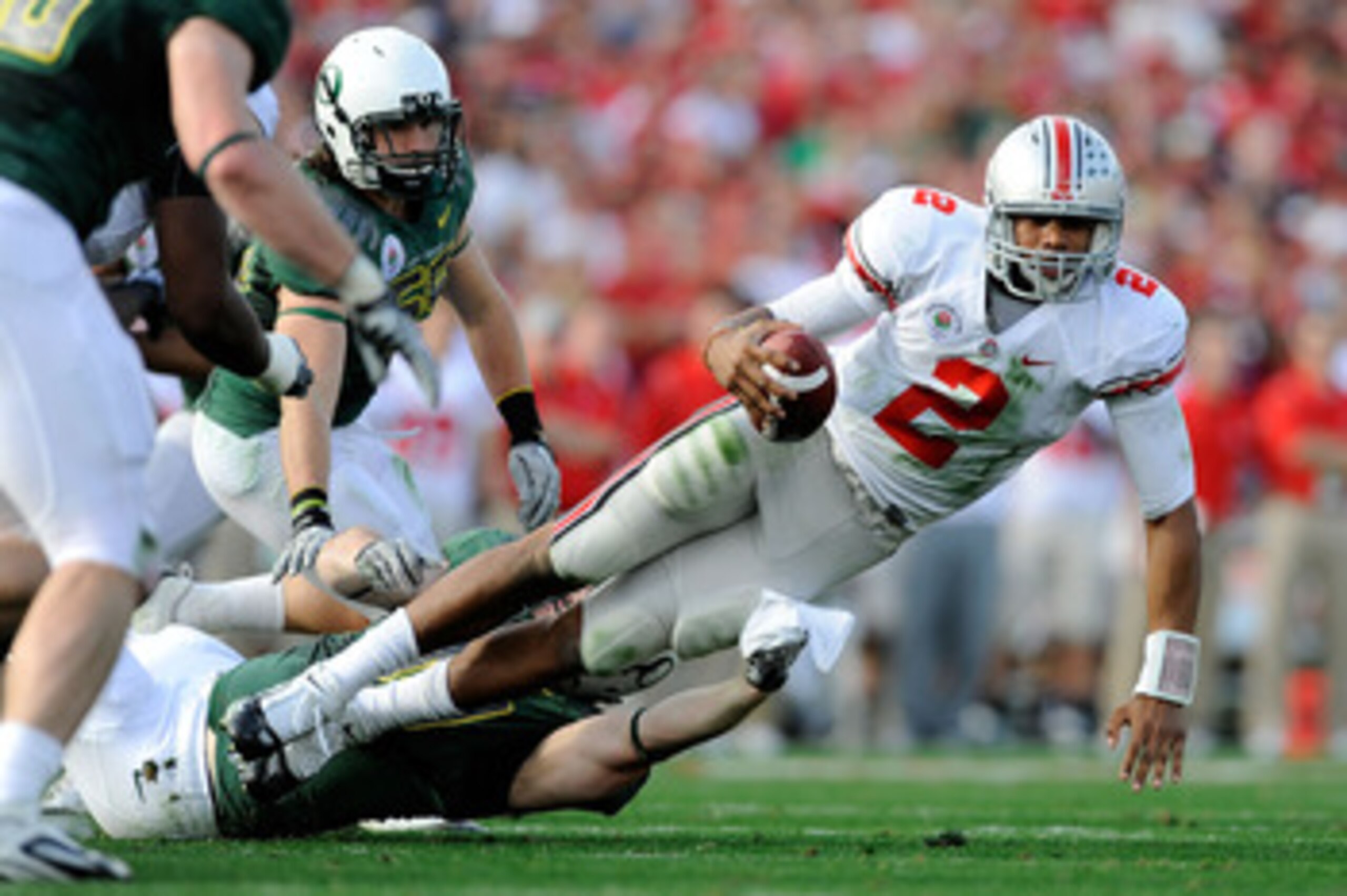PASADENA, CA - JANUARY 01:  Defensive tackle Blake Ferras #90 of the Oregon Ducks sacks quarterback Terrelle Pryor #2 of the Ohio State Buckeyes during the 96th Rose Bowl game on January 1, 2010 in Pasadena, California.  (Photo by Kevork Djansezian/Getty 