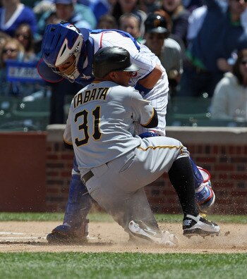 CHICAGO, IL - MAY 27: Jose Tabata #31 of the Pittsburgh Pirates is out as he collides at home plate with Koyie Hill #55 of the Chicago Cubsat Wrigley Field on May 27, 2011 in Chicago, Illinois. (Photo by Jonathan Daniel/Getty Images)