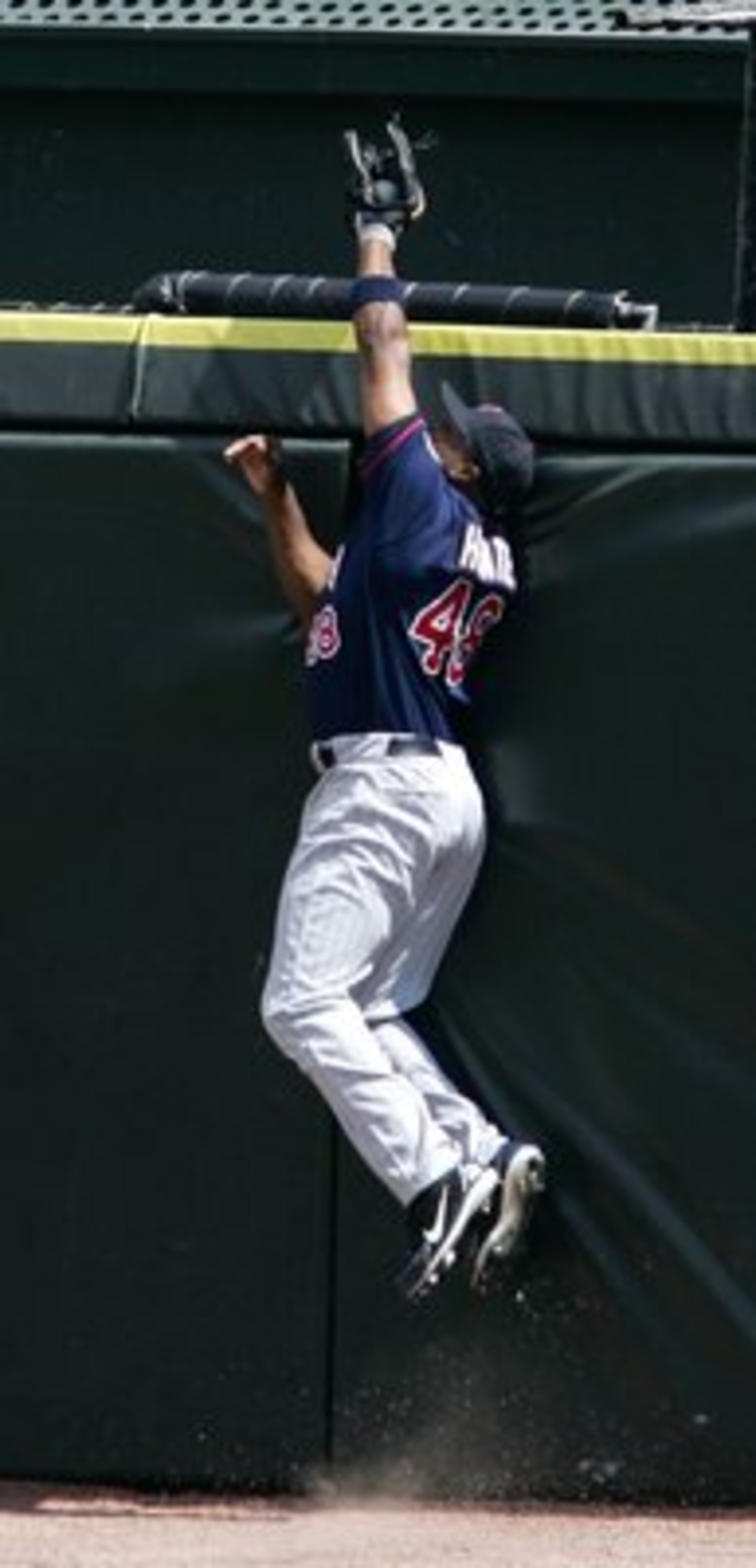 CHICAGO - APRIL 23:  Torii Hunter #48 of the Minnesota Twins makes a leaping catch to rob Paul Konerko of the Chicago White Sox of a home run in the third inning on April 23, 2006 at U.S. Cellular Field in Chicago, Illinois. The White Sox defeated the Twi