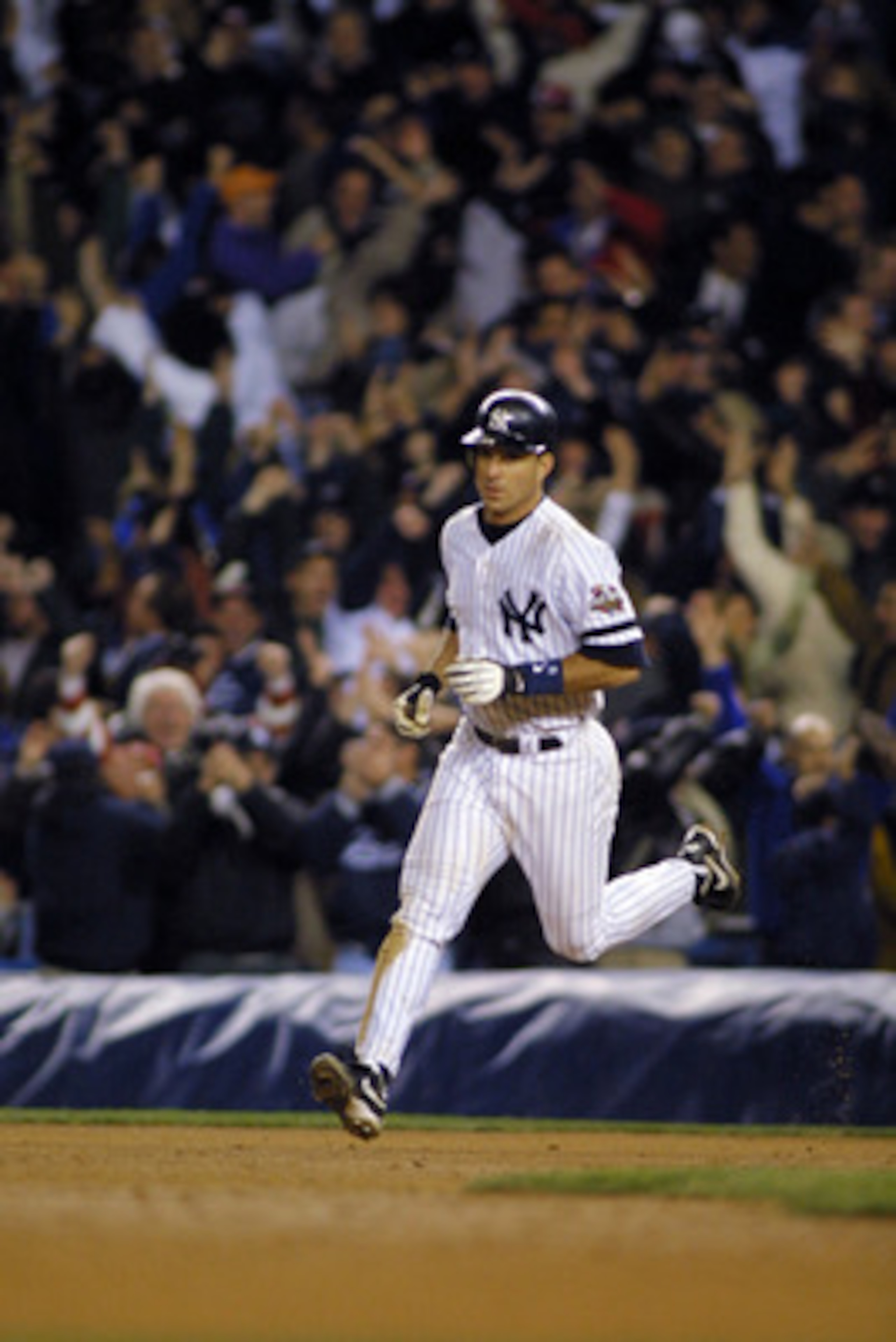 31 Oct 2001: Tino Martinez #24 of the New York Yankees circles the bases after hitting a home run against the Arizona Diamondbacks in the ninth inning during game four of the Major League Baseball World Series at Yankee Stadium in New York, New York.  The
