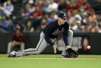 PHOENIX, AZ - MAY 18:  Infielder Freddie Freeman #5 of the Atlanta Braves fields a ground ball out against the Arizona Diamondbacks during the Major League Baseball game at Chase Field on May 18, 2011 in Phoenix, Arizona.  (Photo by Christian Petersen/Get