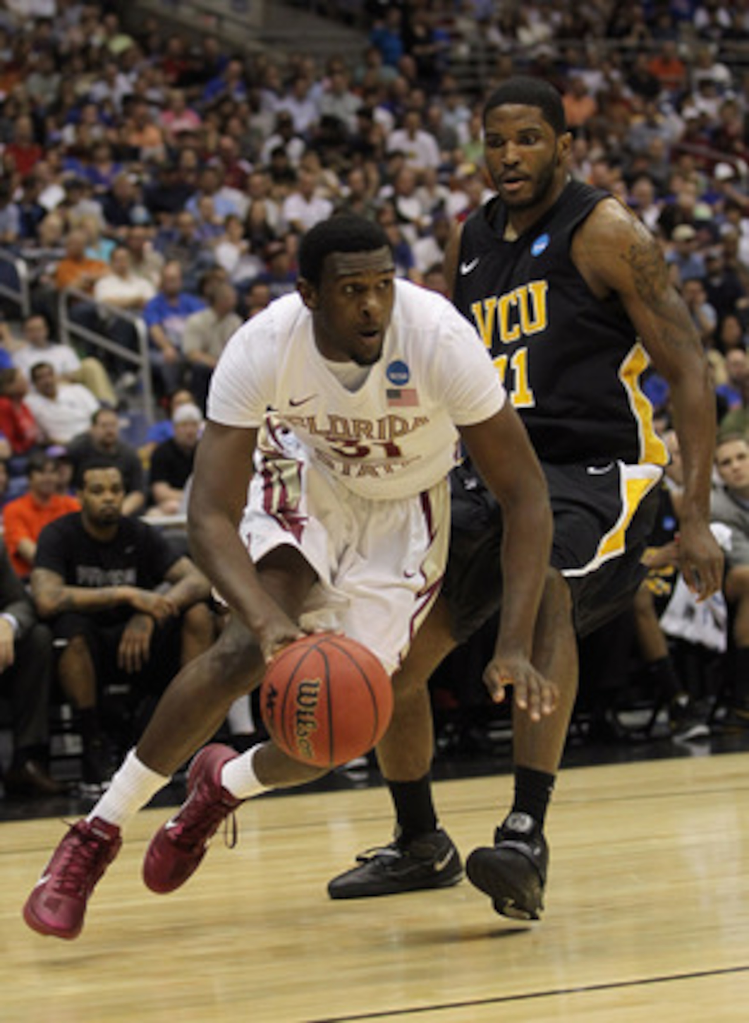 SAN ANTONIO, TX - MARCH 25: Chris Singleton #31 of the Florida State Seminoles drives against Jamie Skeen #21 of the Virginia Commonwealth Rams during the southwest regional of the 2011 NCAA men's basketball tournament at the Alamodome on March 25, 2011 SAN ANTONIO, TX - MARCH 25: Chris Singleton #31 of the Florida State Seminoles drives against Jamie Skeen #21 of the Virginia Commonwealth Rams during the southwest regional of the 2011 NCAA men's basketball tournament at the Alamodome on March 25, 2011