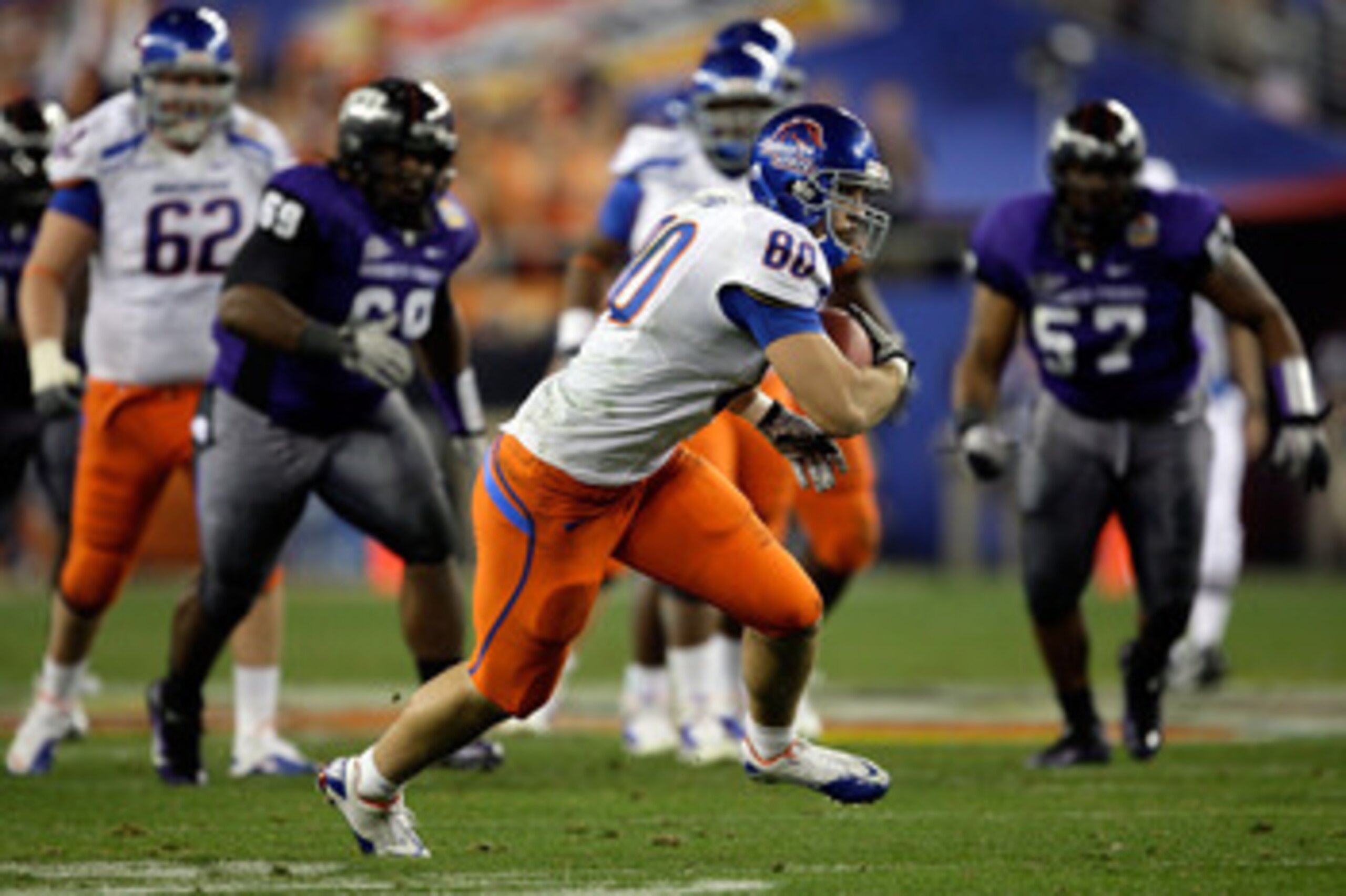 GLENDALE, AZ - JANUARY 04:  Kyle Efaw #80 of the Boise State Broncos runs after a 29-yard catch on a fake punt thrown by kicker Kyle Brotzman #35 in the fourth quarter against the TCU Horned Frogs during the Tostitos Fiesta Bowl at the Universtity of Phoe