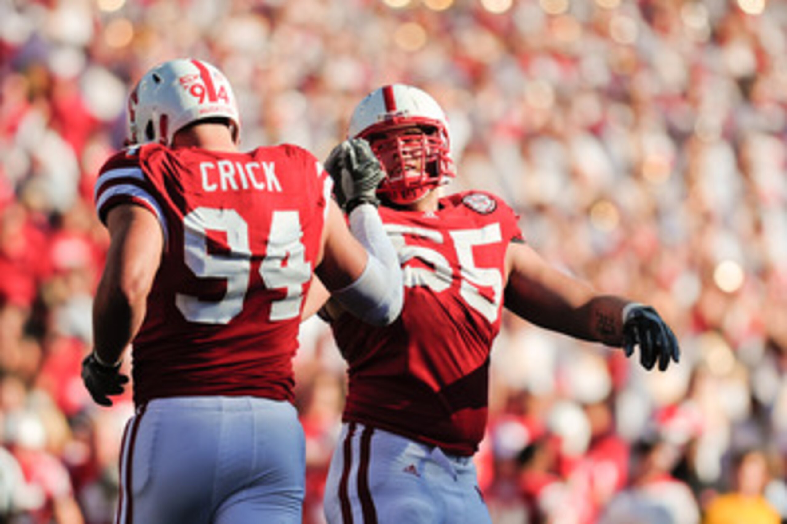 LINCOLN, NE - OCTOBER 30: Defensive tackle Baker Steinkuhler #55 of the Nebraska Cornhuskers high fives teammate defensive tackle Jared Crick #94 after a third down stop during second half action of their game at Memorial Stadium on October 30, 2010 in LINCOLN, NE - OCTOBER 30: Defensive tackle Baker Steinkuhler #55 of the Nebraska Cornhuskers high fives teammate defensive tackle Jared Crick #94 after a third down stop during second half action of their game at Memorial Stadium on October 30, 2010 in