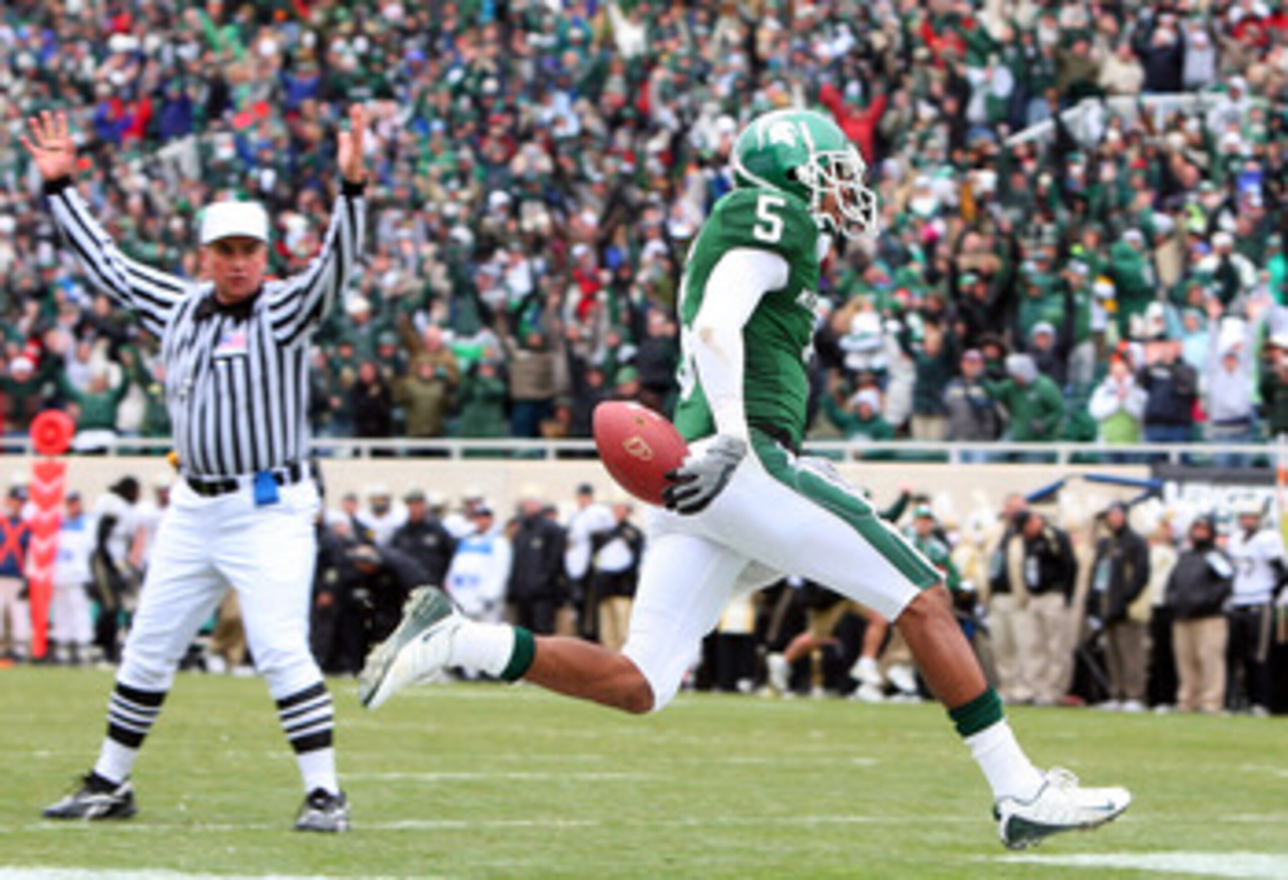 EAST LANSING, MI - NOVEMBER 08: Johnny Adams #5of the Michigan State Spartans runs an interception against the Purdue Boilermakers for a touchdown at Spartan Stadium on November 8, 2008 in East Lansing, Michigan. (Photo by Jim McIsaac/Getty Images) EAST LANSING, MI - NOVEMBER 08: Johnny Adams #5of the Michigan State Spartans runs an interception against the Purdue Boilermakers for a touchdown at Spartan Stadium on November 8, 2008 in East Lansing, Michigan. (Photo by Jim McIsaac/Getty Images)