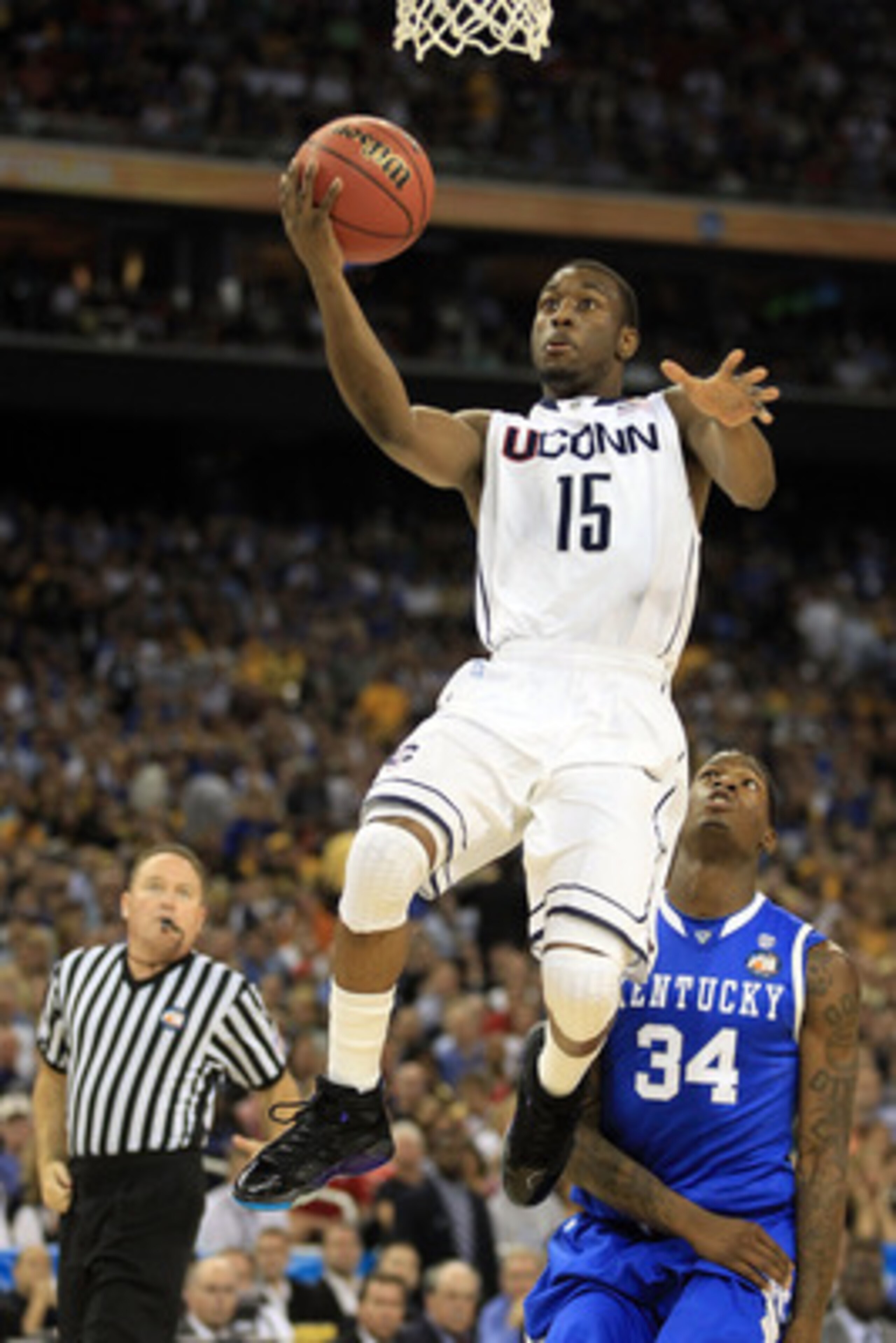 HOUSTON, TX - APRIL 02: Kemba Walker #15 of the Connecticut Huskies goes to the hoop against the Kentucky Wildcats during the National Semifinal game of the 2011 NCAA Division I Men's Basketball Championship at Reliant Stadium on April 2, 2011 in Houston HOUSTON, TX - APRIL 02: Kemba Walker #15 of the Connecticut Huskies goes to the hoop against the Kentucky Wildcats during the National Semifinal game of the 2011 NCAA Division I Men's Basketball Championship at Reliant Stadium on April 2, 2011 in Houston