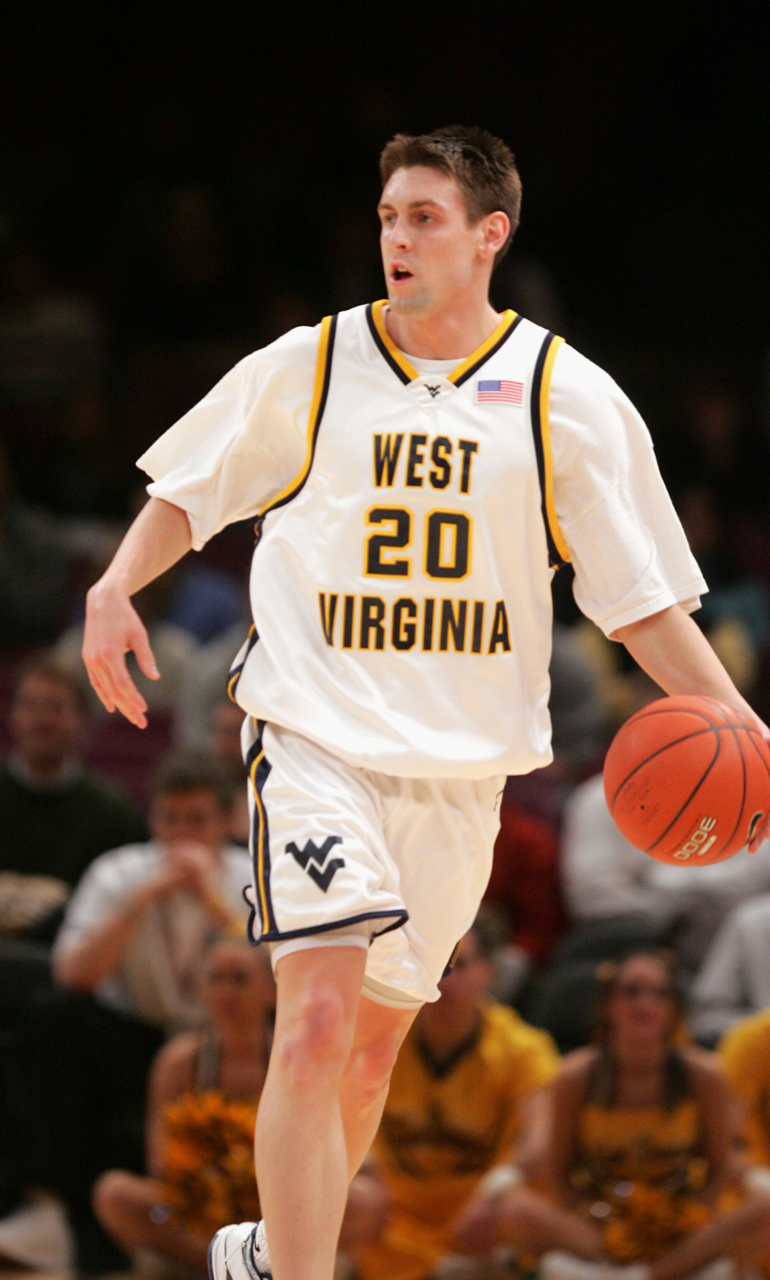 NEW YORK - MARCH 9:   Mike Gansey  #20 of the West Virginia University Mountaineers drives against the Providence College Friars during the Big East Men's Basketball Championship on March 9, 2005 at Madison Square Garden in New York City. The Mountaineers