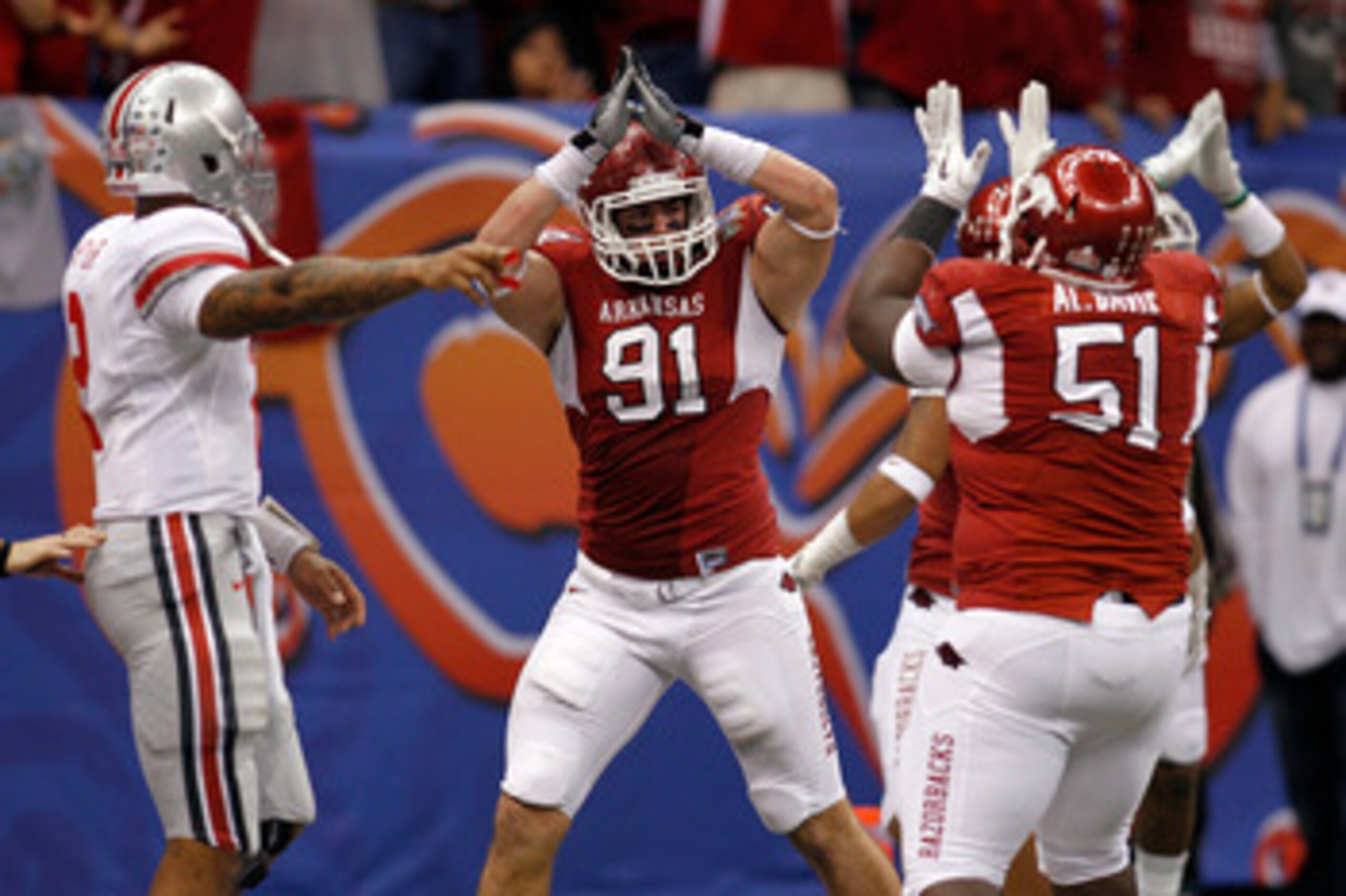 NEW ORLEANS, LA - JANUARY 04:  Jake Bequette #91 of the Arkansas Razorbacks signals a safety after stopping running back Dan Herron #1 of the Ohio State Buckeyes in the endzone in the fourth quarter during the Allstate Sugar Bowl at the Louisiana Superdom
