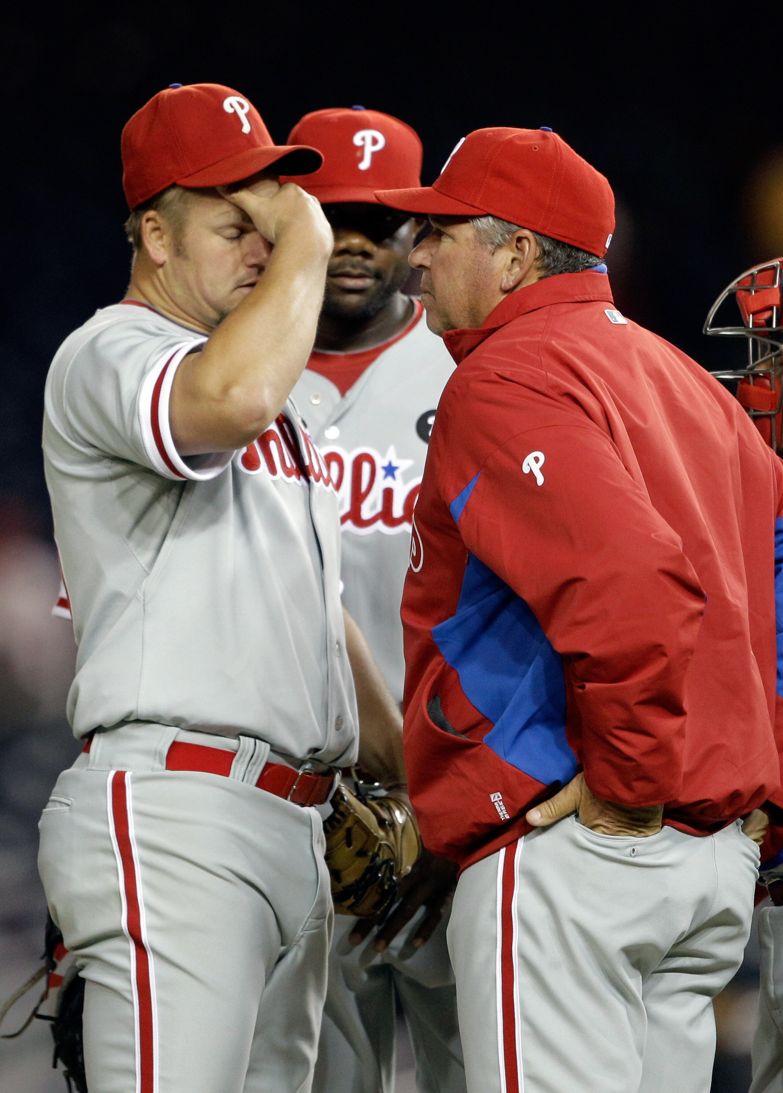 WASHINGTON, DC - APRIL 12:  Starting pitcher Joe Blanton #56 of the Philadelphia Phillies (L) talks with pitching coach Rich Dubee (R) during the fourth inning against the Washington Nationals at Nationals Park on April 12, 2011 in Washington, DC.  (Photo