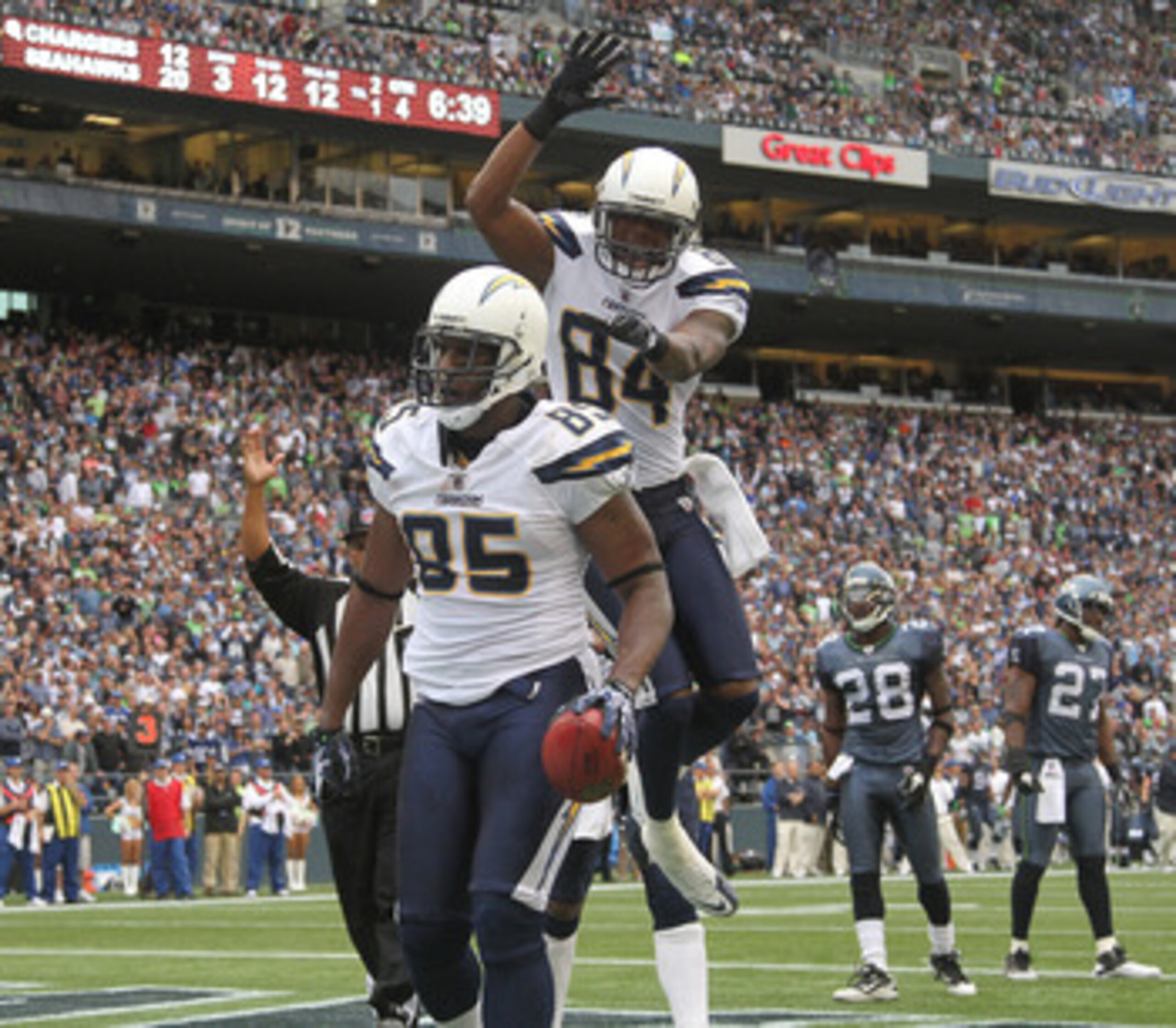 SEATTLE - SEPTEMBER 26:  Tight end Antonio Gates #85 of the San Diego Chargers celebrates with Buster Davis #84 after scoring a touchdown in the fourth quarter against the Seattle Seahawks at Qwest Field on September 26, 2010 in Seattle, Washington. The S