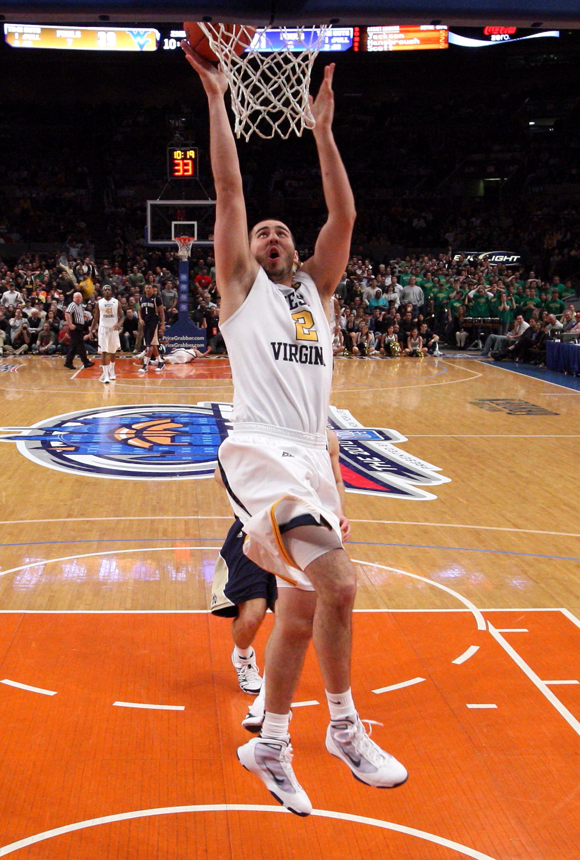 NEW YORK - MARCH 12: Cam Thoroughman #2 of the West Virginia Mountaineers goes to the hoop against the Notre Dame Fighting Irish during the semifinal of the 2010 Big East Tournament at Madison Square Garden on March 12, 2010 in New York City.  (Photo by J