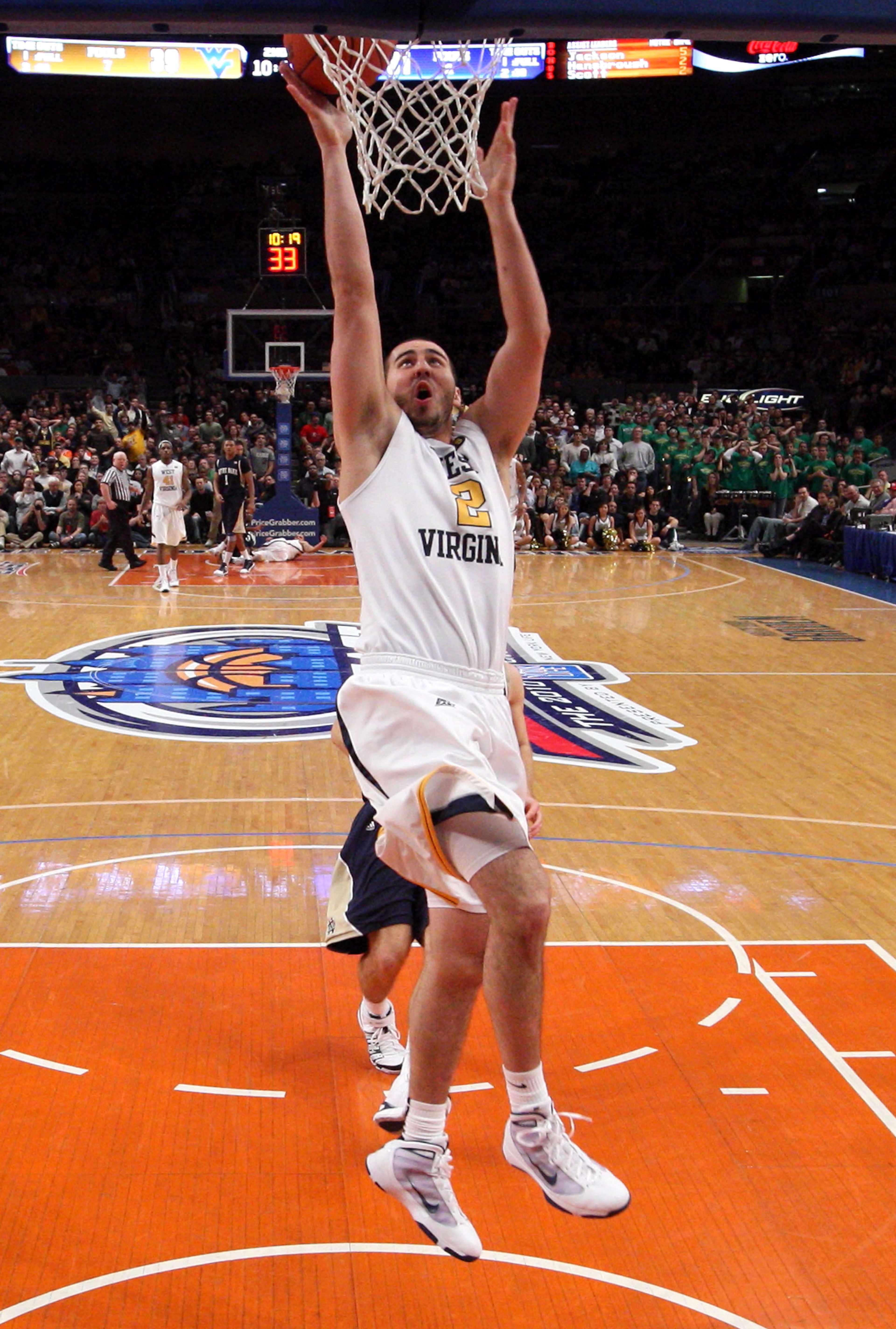 NEW YORK - MARCH 12: Cam Thoroughman #2 of the West Virginia Mountaineers goes to the hoop against the Notre Dame Fighting Irish during the semifinal of the 2010 Big East Tournament at Madison Square Garden on March 12, 2010 in New York City.  (Photo by J