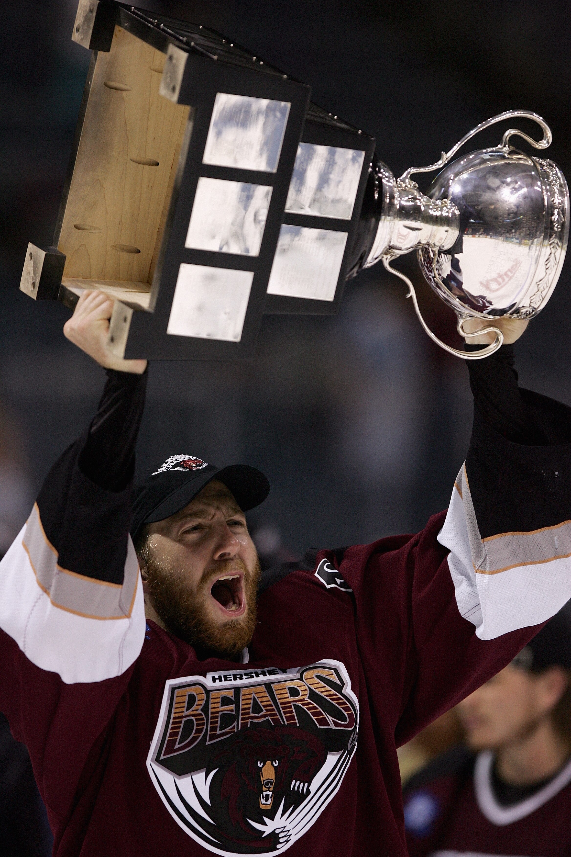 MILWAUKEE - JUNE 15:  Eric Fehr #11 of the Hershey Bears celebrates with the Calder Cup after the Hershey Bears defeated the Milwaukee Admirals in game six of the AHL Calder Cup Finals on June 15, 2006 at the Bradley Center in Milwaukee, Wisconsin. The Be