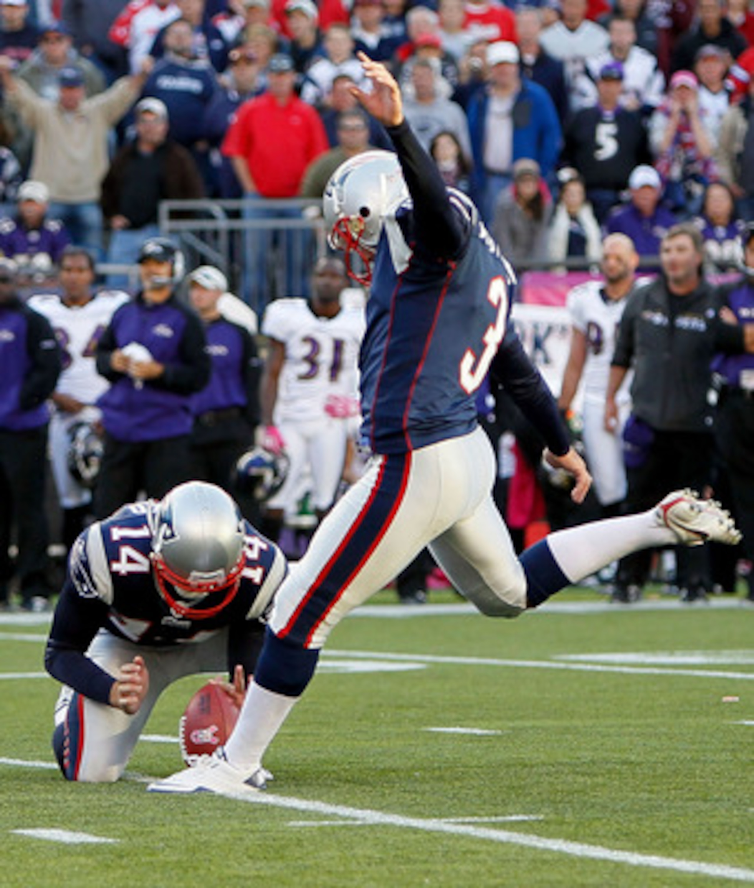 FOXBORO, MA - OCTOBER 17:  Stephen Gostkowski #3 of the New England Patriots kicks the game winning field goal against the Baltimore Ravens watches from the sidelines at Gillette Stadium on October 17, 2010 in Foxboro, Massachusetts. The Patriot won 23-20