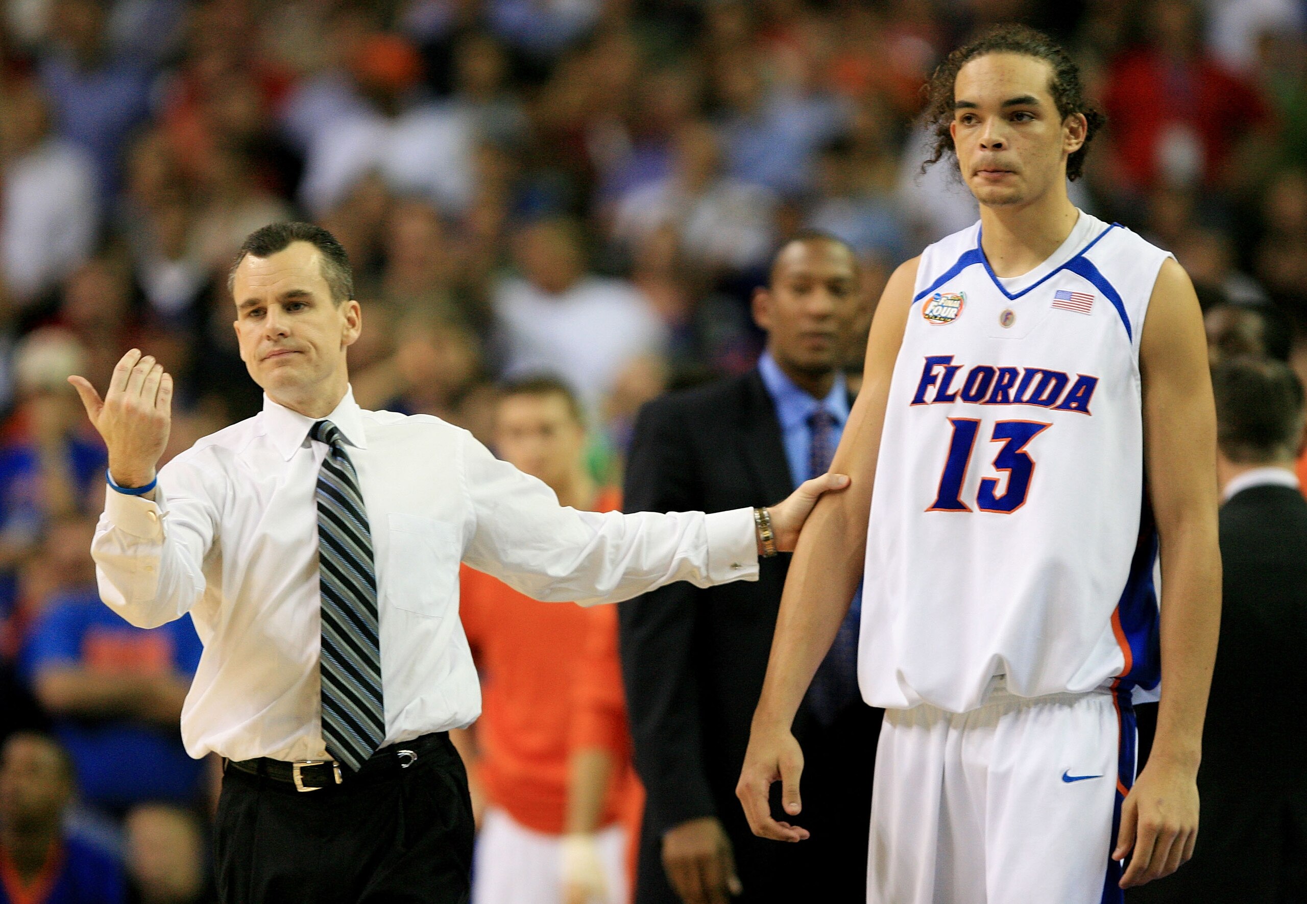 ATLANTA - APRIL 02:  Head coach Billy Donovan of the Florida Gators grabs Joakim Noah #13 during their game against the Ohio State Buckeyes during the NCAA Men's Basketball Championship game at the Georgia Dome on April 2, 2007 in Atlanta, Georgia.  (Phot