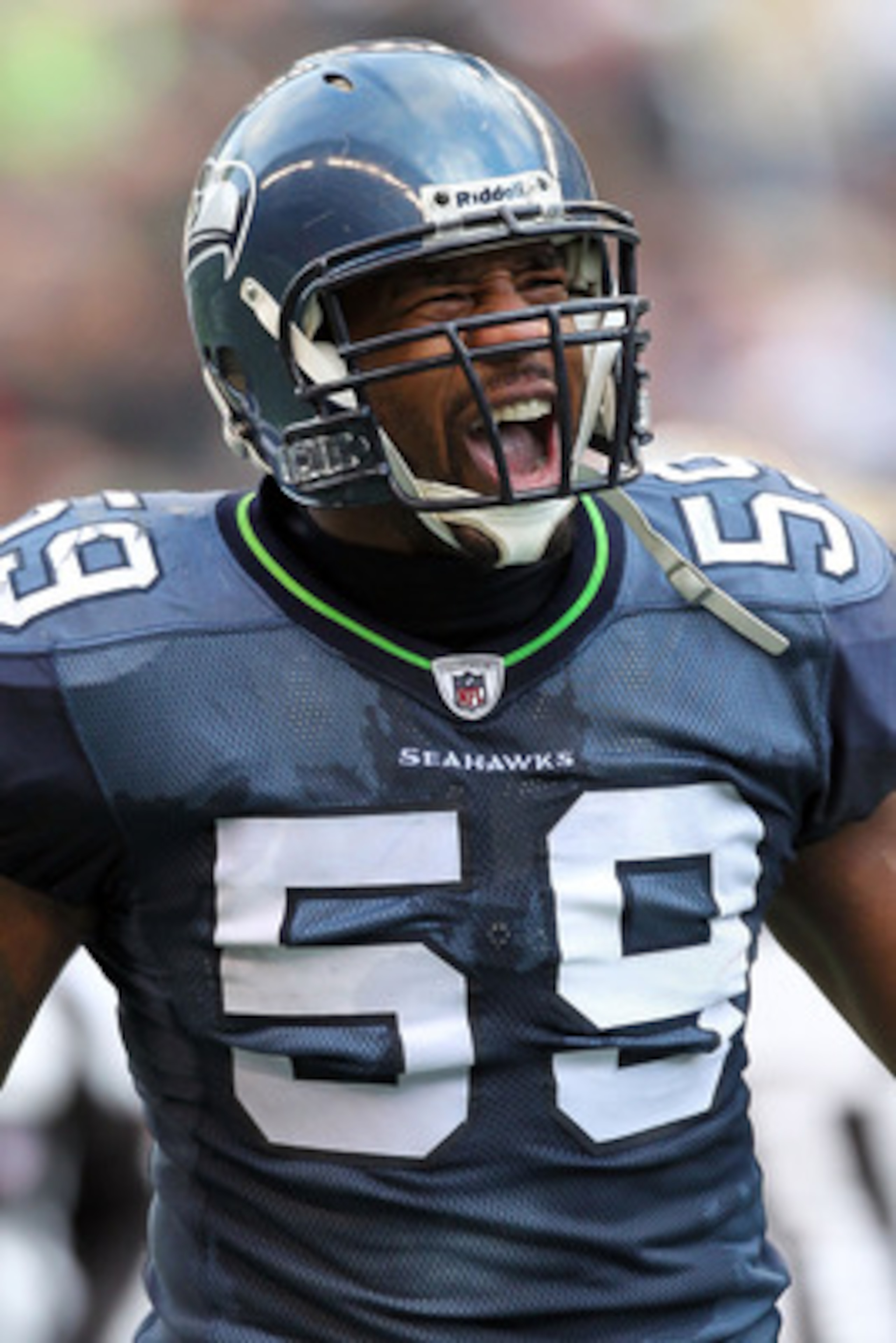SEATTLE, WA - JANUARY 08:  Linebacker Aaron Curry #59 of the Seattle Seahawks reacts after the Seahawks force a turnover in the second quarter against the New Orleans Saints during the 2011 NFC wild-card playoff game at Qwest Field on January 8, 2011 in S