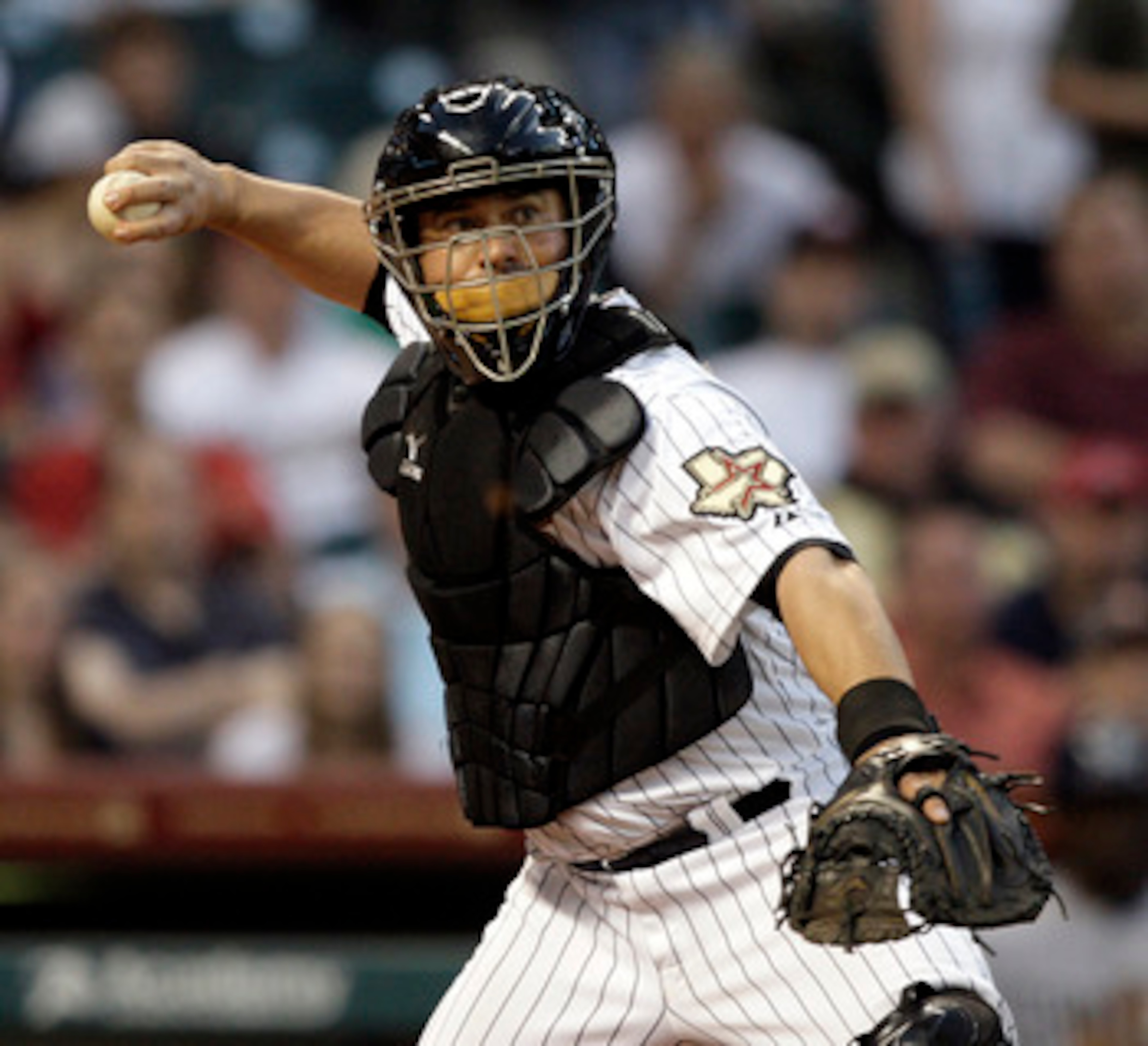HOUSTON - APRIL 15:  Catcher Humberto Quintero #55 of the Houston Astros throws to first base to retire Jason Bartlett of the San Diego Padres at Minute Maid Park on April 15, 2011 in Houston, Texas.  (Photo by Bob Levey/Getty Images)