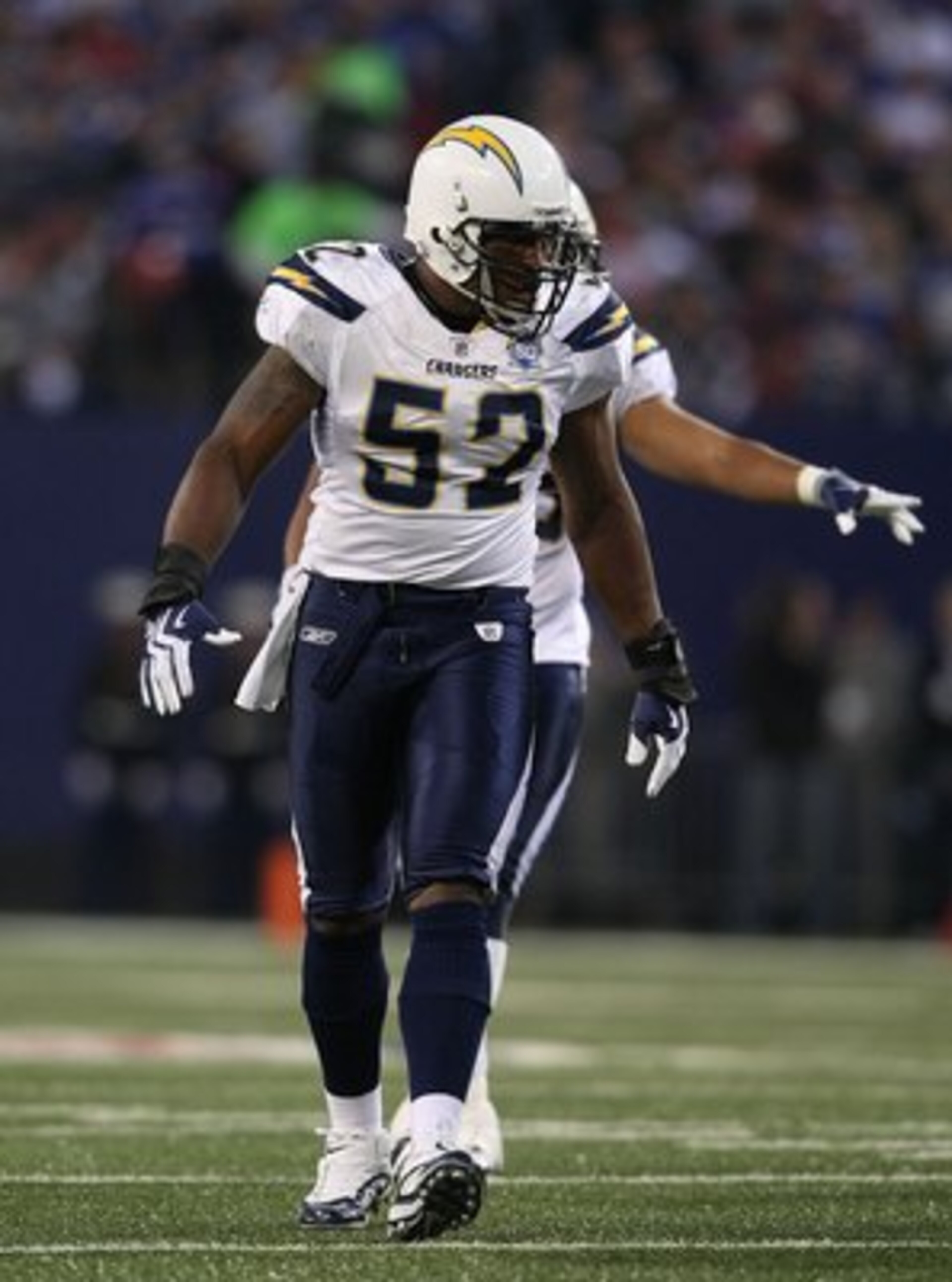 EAST RUTHERFORD, NJ - NOVEMBER 8:  Larry English #52 of the San Diego Chargers gestures against the New York Giants at Giants Stadium on November 8, 2009 in East Rutherford, New Jersey. The Chargers defeated the Giants 21-20.  (Photo by Nick Laham/Getty I