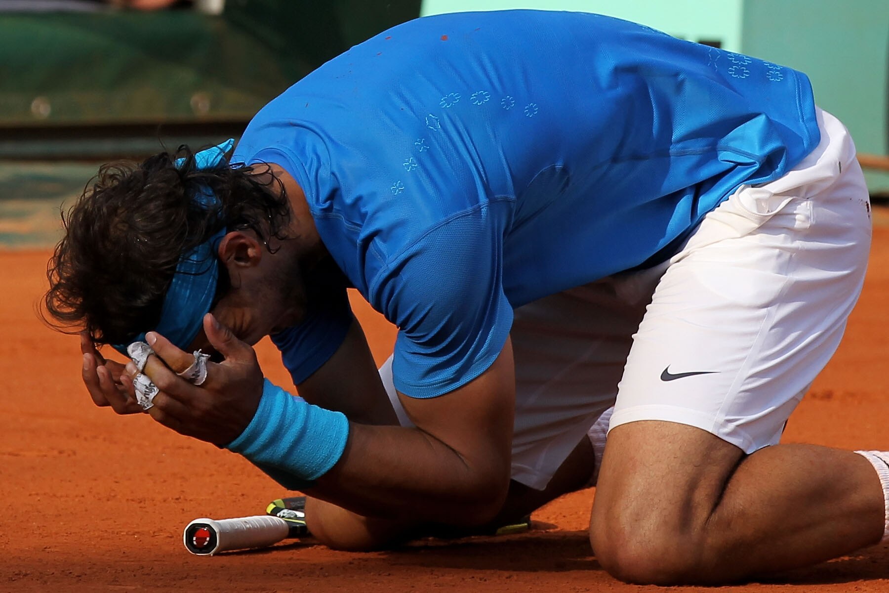 PARIS, FRANCE - JUNE 05:  Rafael Nadal of Spain celebrates match point during the men's singles final match between Rafael Nadal of Spain and Roger Federer of Switzerland on day fifteen of the French Open at Roland Garros on June 5, 2011 in Paris, France.