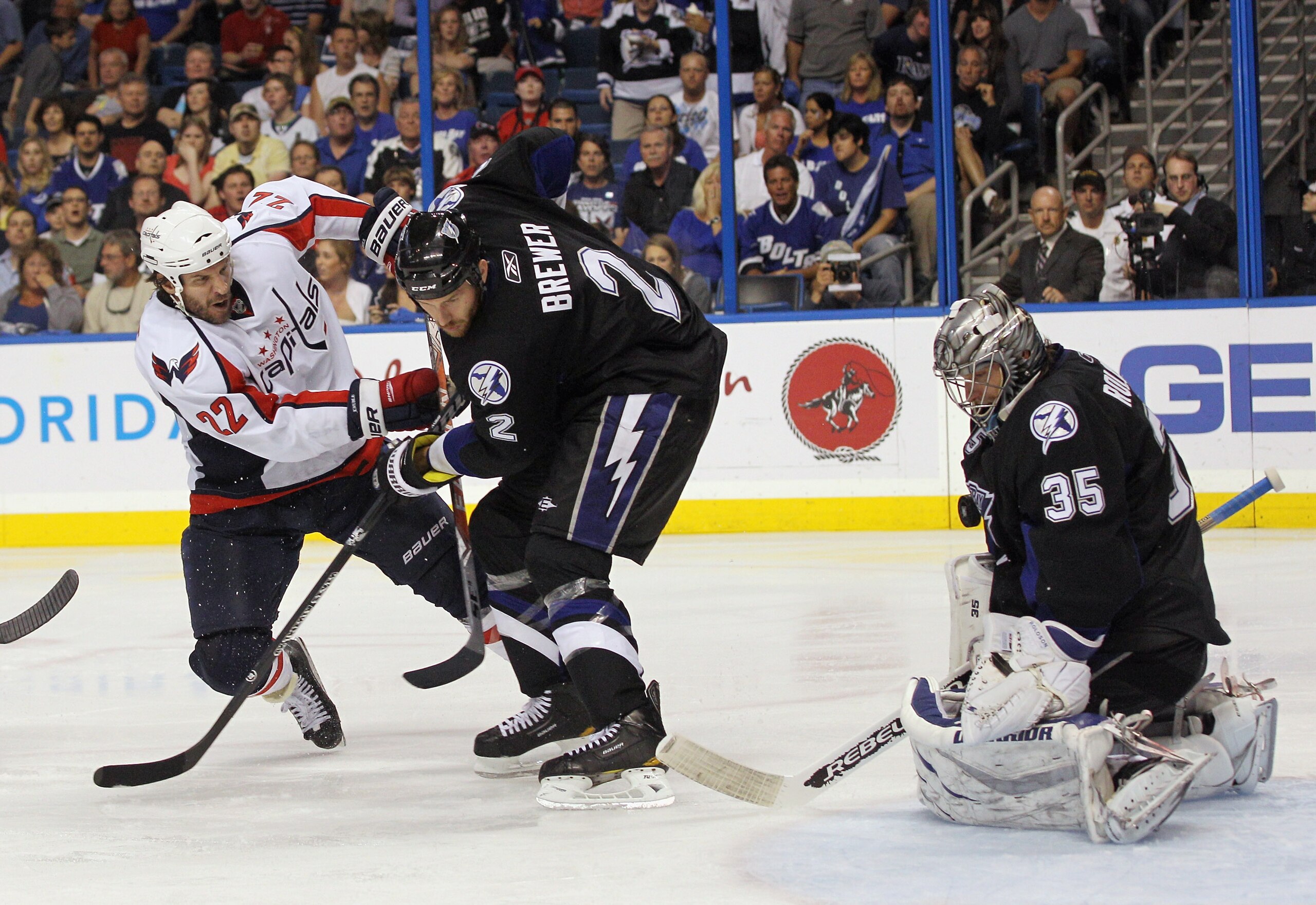 TAMPA, FL - MAY 04: Dwayne Roloson #35 of the Tampa Bay Lightning makes the save on Mike Knuble #22 of the Washington Capitals as Eric Brewer #2 assists him in Game Four of the Eastern Conference Semifinals during the 2011 NHL Stanley Cup Playoffs at the