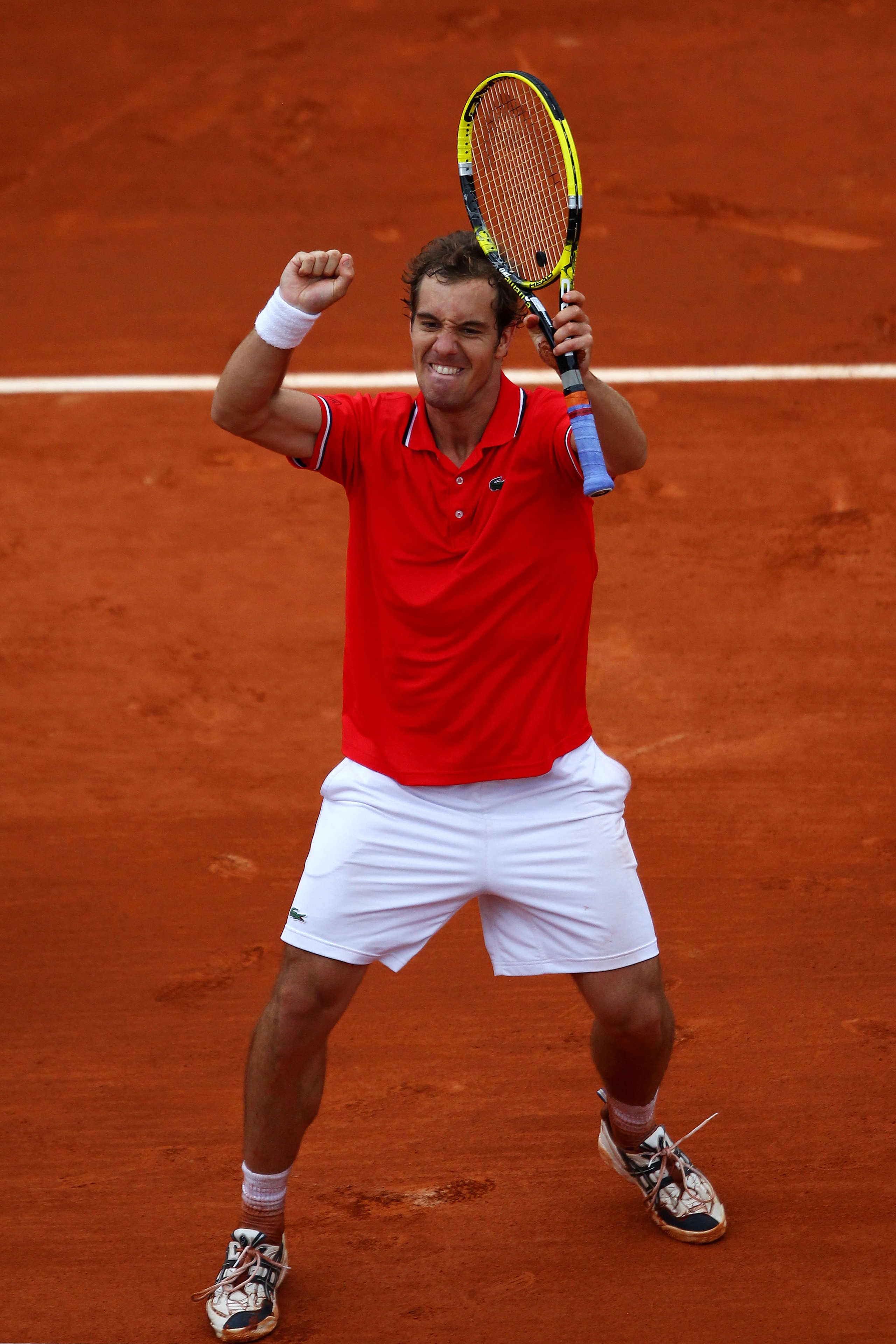 PARIS, FRANCE - MAY 27:  Richard Gasquet of France celebrates match point during the men's singles round three match between Richard Gasquet of France and Thomaz Bellucci of Brazil on day six of the French Open at Roland Garros on May 27, 2011 in Paris, F