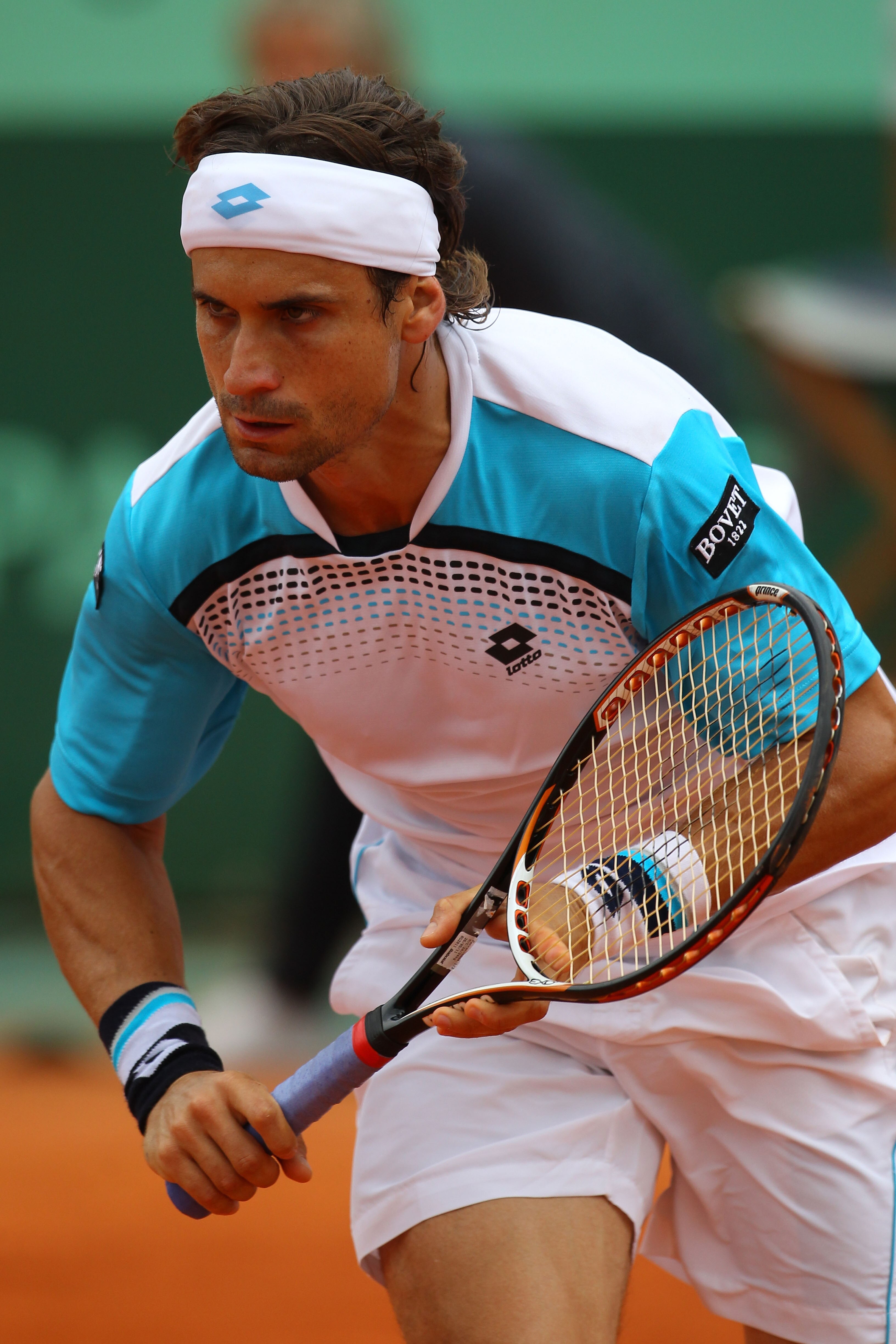 PARIS, FRANCE - MAY 27:  David Ferrer of Spain in action during the men's singles round three match between David Ferrer of Spain and Sergiy Stakhovsky of Ukraine on day six of the French Open at Roland Garros on May 27, 2011 in Paris, France.  (Photo by