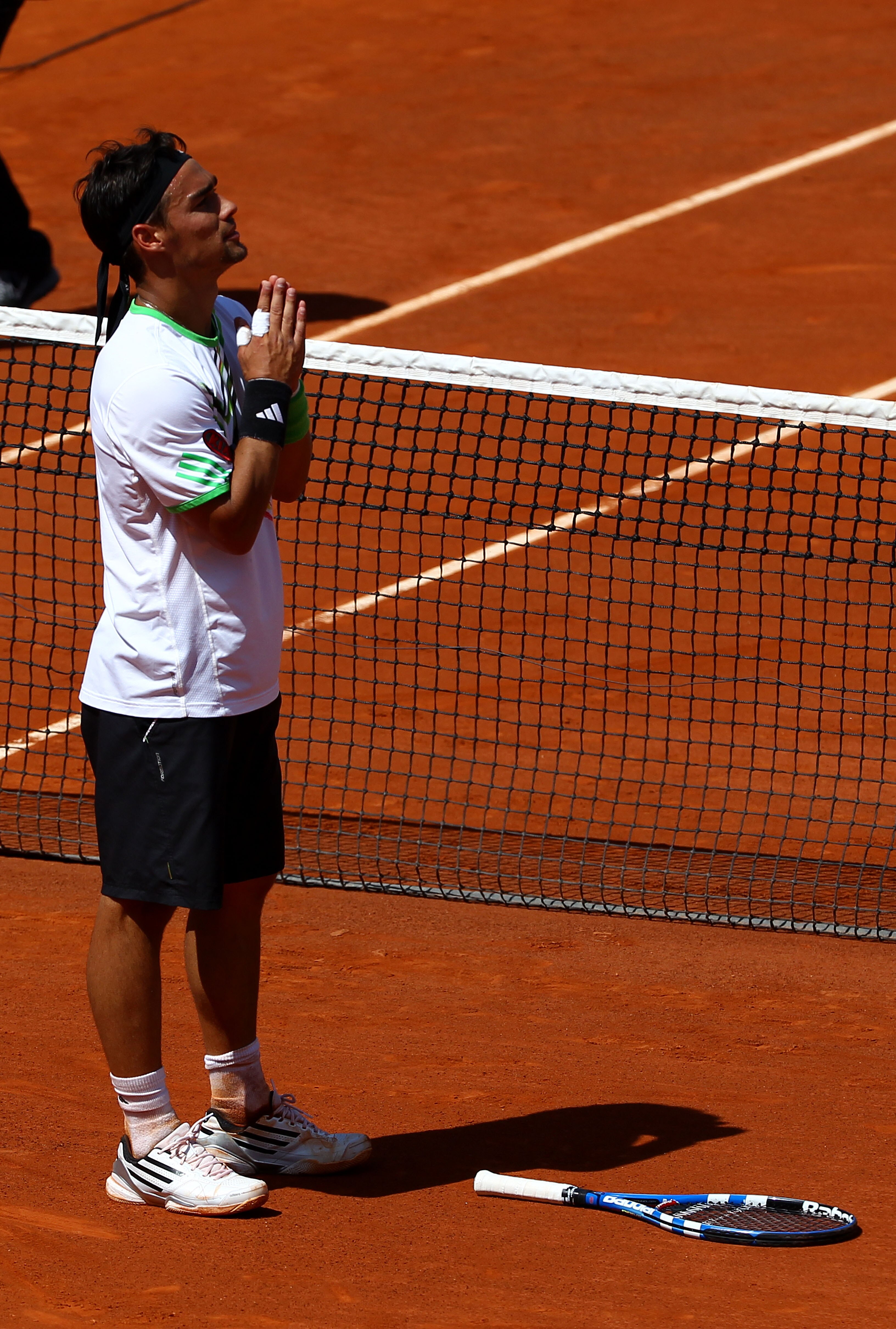 PARIS, FRANCE - MAY 29:  Fabio Fognini of Italy appeals to the crowd as he is booed after winning the men's singles round four match between Fabio Fognini of Italy and Albert Montanes of Spain on day eight of the French Open at Roland Garros on May 29, 20