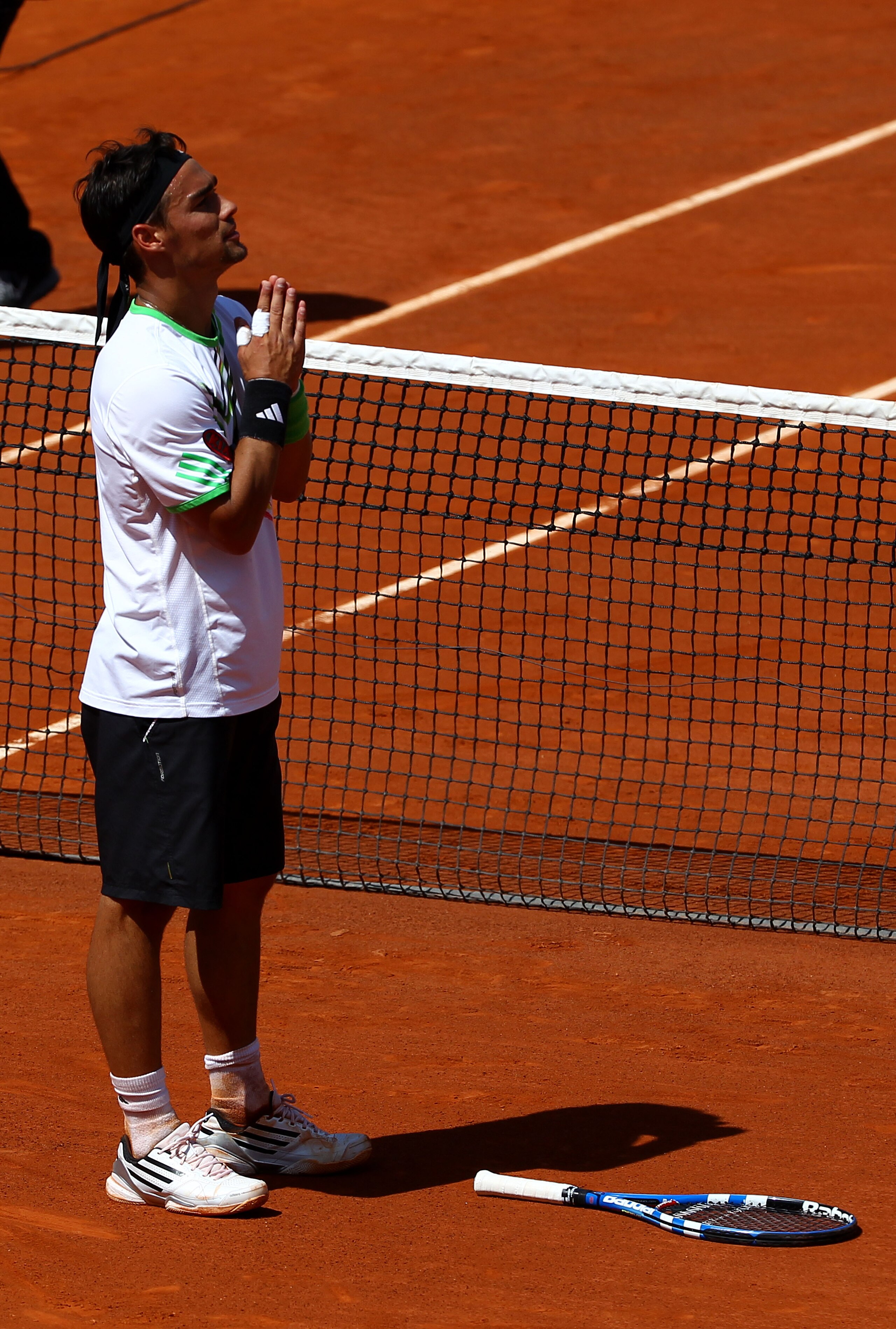PARIS, FRANCE - MAY 29:  Fabio Fognini of Italy appeals to the crowd as he is booed after winning the men's singles round four match between Fabio Fognini of Italy and Albert Montanes of Spain on day eight of the French Open at Roland Garros on May 29, 20