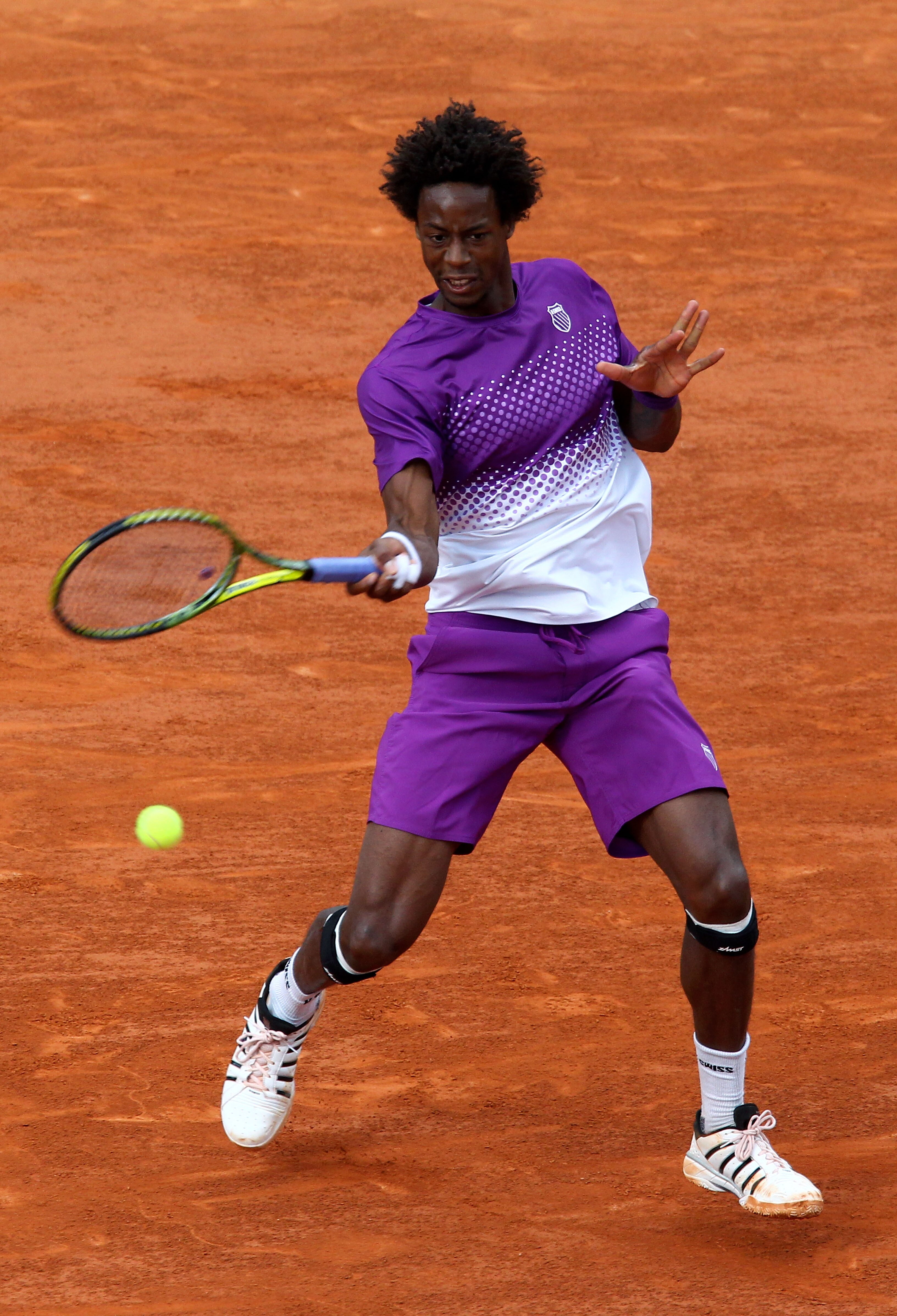 PARIS, FRANCE - MAY 31:  Gael Monfils of France hits a forehand during the men's singles quarterfinal match between Gael Monfils of France and Roger Federer of Switzerland on day ten of the French Open at Roland Garros on May 31, 2011 in Paris, France.  (