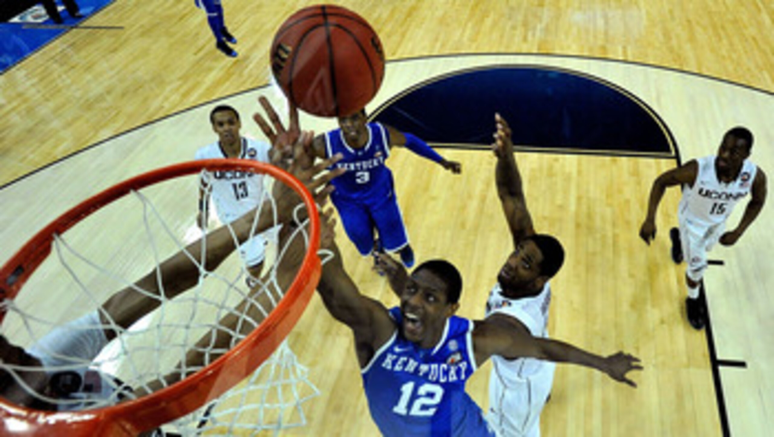 HOUSTON, TX - APRIL 02:  Brandon Knight #12 of the Kentucky Wildcats goes to the hoop against Alex Oriakhi #34 of the Connecticut Huskies during the National Semifinal game of the 2011 NCAA Division I Men's Basketball Championship at Reliant Stadium on Ap