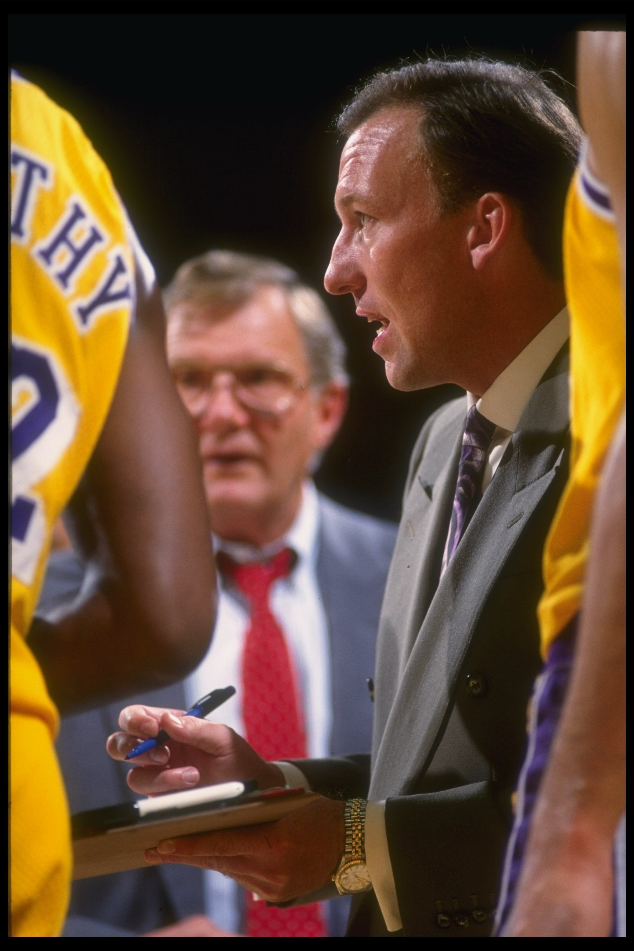1990-1991:  Los Angeles Lakers head coach Mike Dunleavy confers with his team during a game against the Portland Trail Blazers at the Rose Garden in Portland, Oregon. Mandatory Credit: Stephen Dunn  /Allsport Mandatory Credit: Stephen Dunn  /Allsport