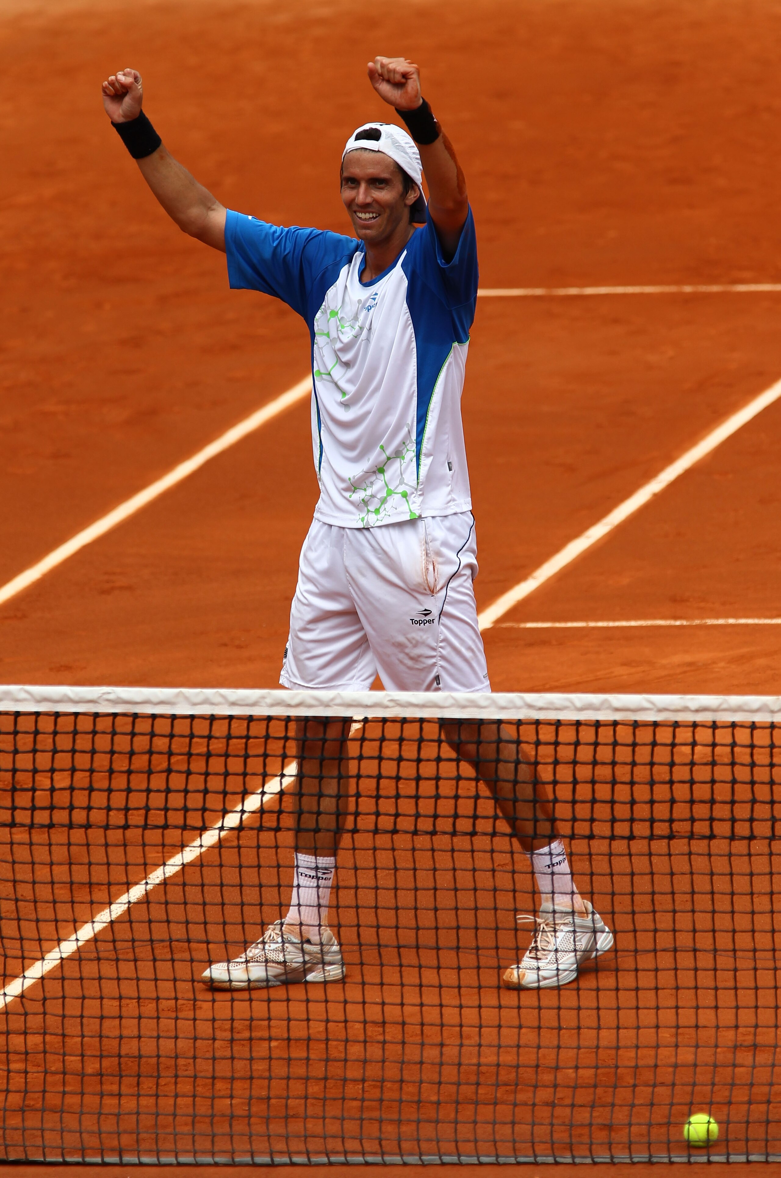 PARIS, FRANCE - MAY 30:  Juan Ignacio Chela of Argentina  celebrates matchpoint during the men's singles round four match between Alejandro Falla of Columbia and Juan Ignacio Chela of Argentina on day nine of the French Open at Roland Garros on May 30, 20