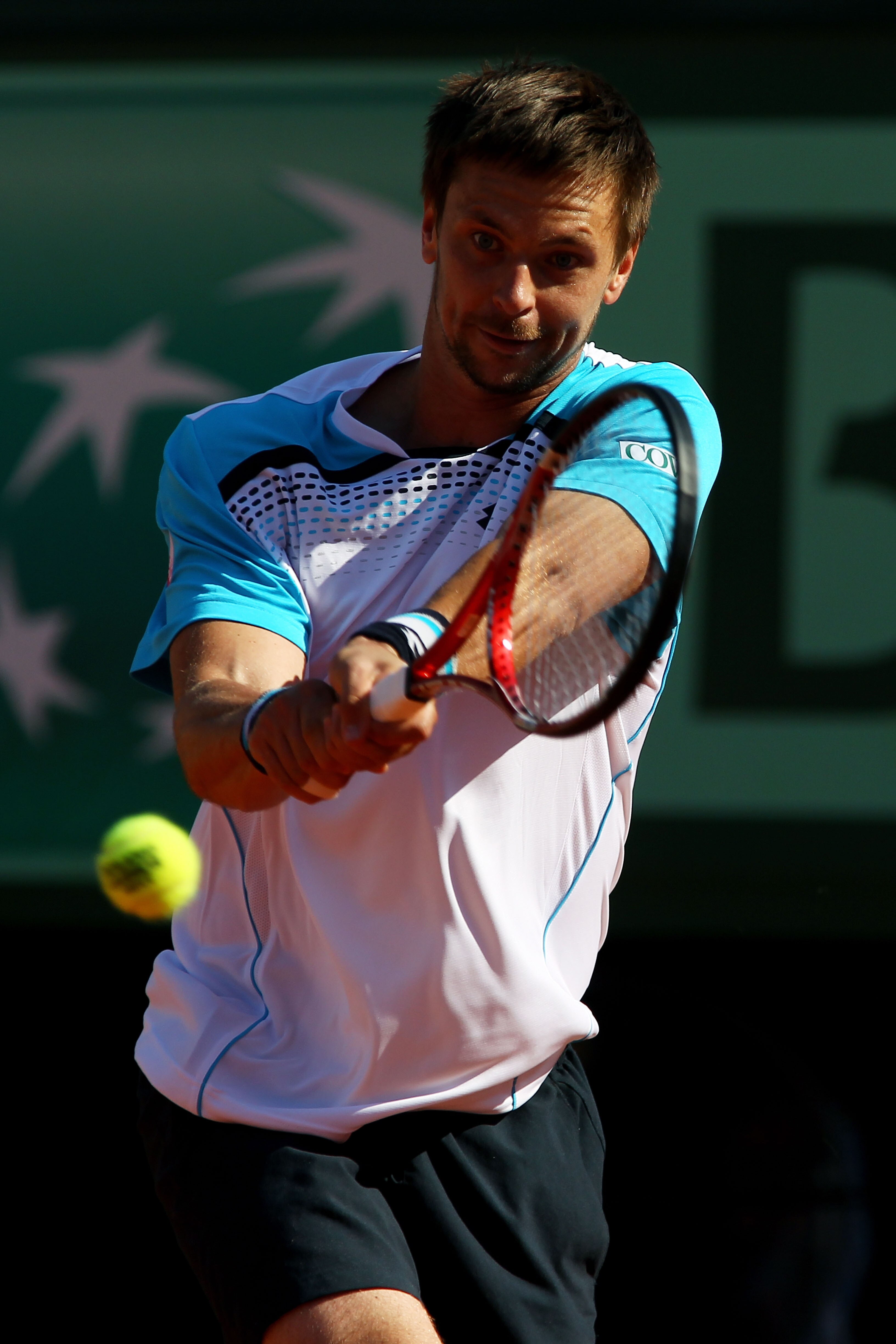 PARIS, FRANCE - JUNE 01:  Robin Soderling of Swedenhits a backhand during the men's singles quarterfinal match between Rafael Nadal of Spain and Robin Soderling of Sweden on day eleven of the French Open at Roland Garros on June 1, 2011 in Paris, France.